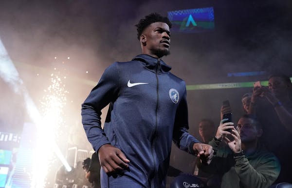 Minnesota Timberwolves guard Jimmy Butler (23) took the court to a mixture of cheers and boos. ] ANTHONY SOUFFLE &#xef; anthony.souffle@startribune.co