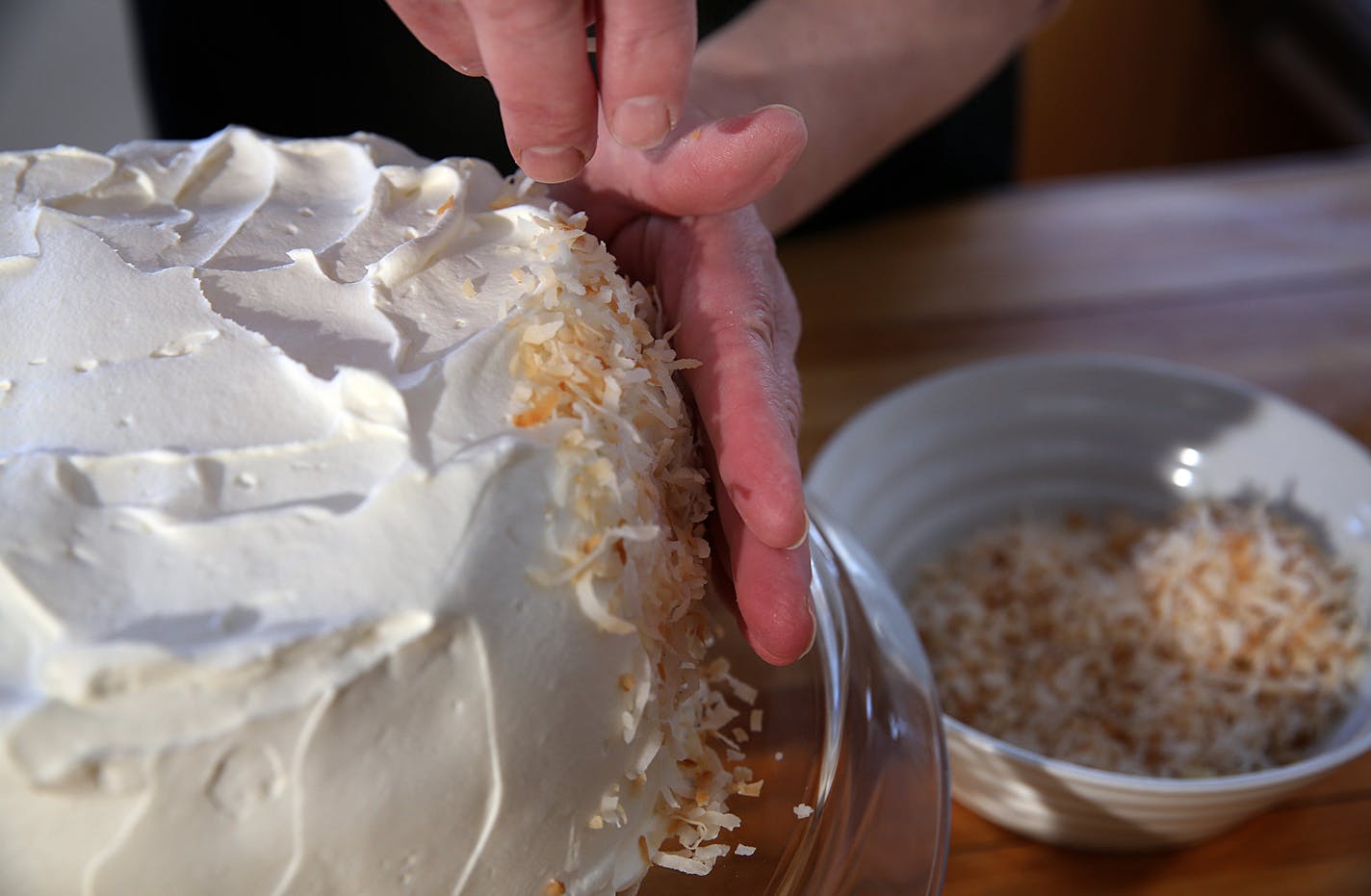 Coconut cake.] JIM GEHRZ &#x201a;&#xc4;&#xa2; jgehrz@startribune.com / Minneapolis, MN / April 4, 2014 / 1:00 PM BACKGROUND INFORMATION: Reporter Kim Ode bakes a coconut cake for Baking Central, complete with step-by-step photos showing the making of batter and custard, assembling and decorating.