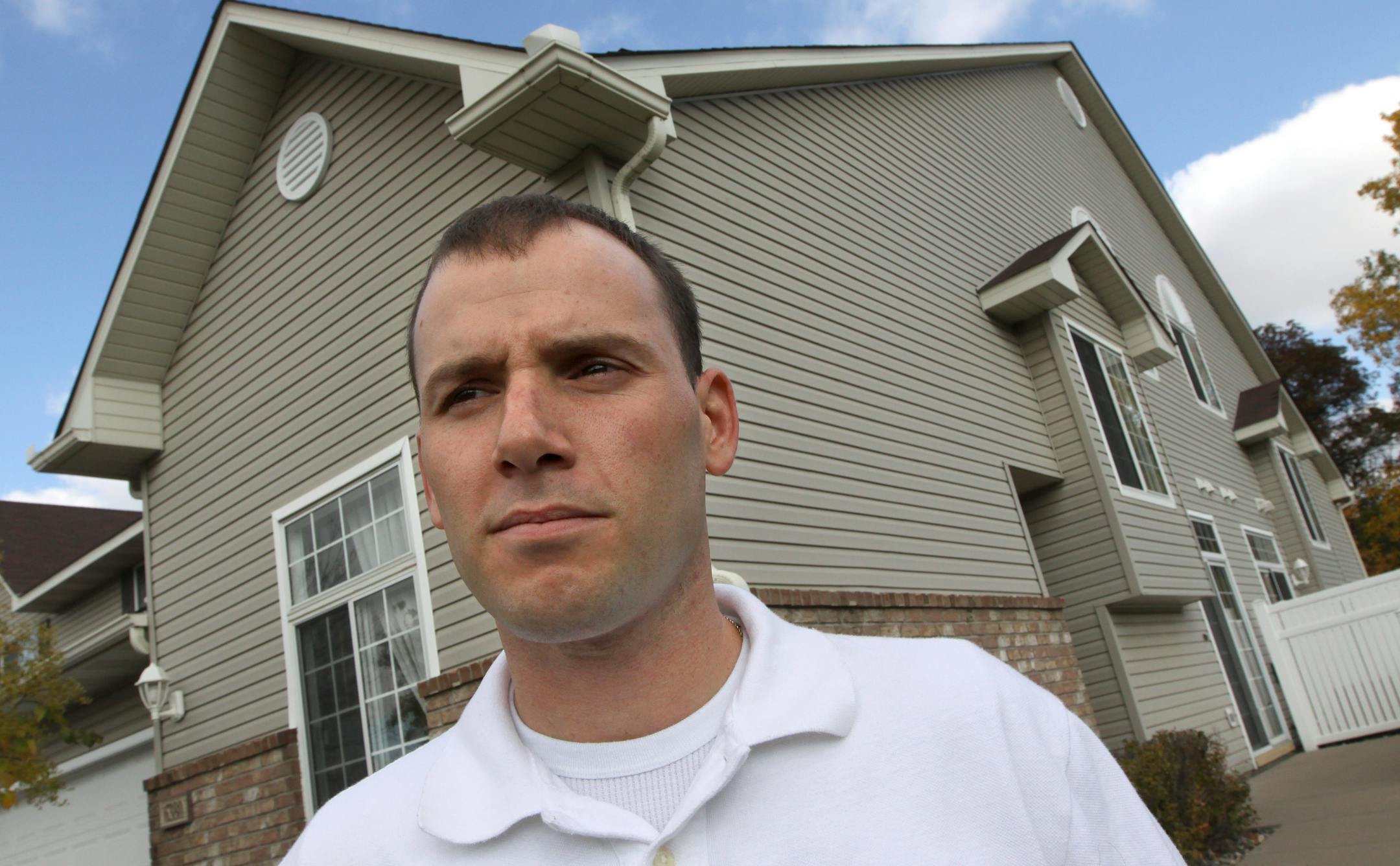 (center) Marcus Caruso, Iraq veteran has been looking for a job since arriving back from service and has moved into his mother-in-law's Woodbury townhome with wife, Alanna and daughter Gianna. Caruso is doing landscaping work to make spare money until he can find a full-time job.