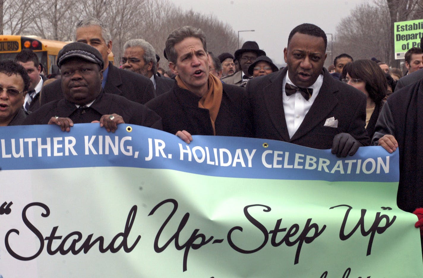 l to r Rev Dr. Al Sampson was the keynote speaker , Sen. Norm Coleman and Tyrone Terrill Human Rights Dir. St Paul march along Marshal Ave in the MLK Day Parade enroute to Concordia University GENERAL INFORMATION: RICHARD SENNOTTïrsennott@startribune.com St Paul Mn. Monday 1/16/2006 March from Central High, St. Paul, to Concordia University, 11 a.m. the Gov's Commission on the Dr. MLK Jr. Statewide Celebration