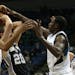 Wolves Corey Brewer and Gorgui Dieng stripped the ball from Spurs Manu Ginobili in the first half. ] (KYNDELL HARKNESS/STAR TRIBUNE) kyndell.harkness@