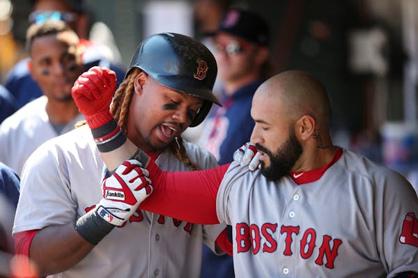 Red Sox Hanley Ramirez left, celebrated with Sandy Leon after he hit a two run homer in the sixth inning at Target Field Sunday May 7, 2017 in Minneap