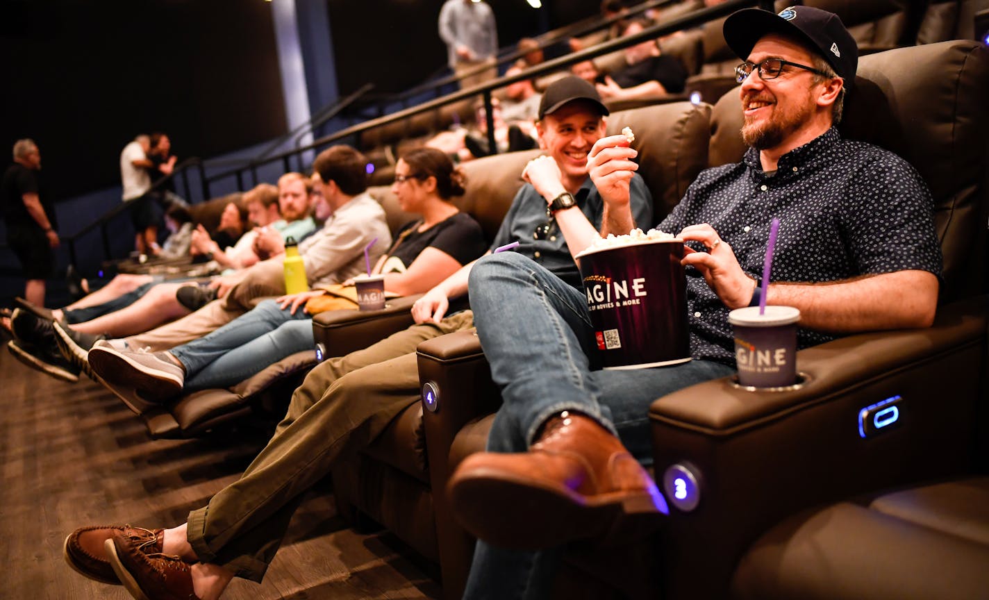 From right, Alex Griendling, of Minneapolis, and Luke Mills, of St. Paul, joked around while waiting for the start of a special screening o 2001: A Space Odyssey on 70mm film Tuesday at the Emagine Willow Creek theater. ] AARON LAVINSKY &#xef; aaron.lavinsky@startribune.com Mall of America is the latest Twin Cities theater complex to do a major overhaul, after Marcus and Emagine and AMC have done similar refreshes. In the summer, Alamo Drafthouse will bring an even newer concept. Craft beer and