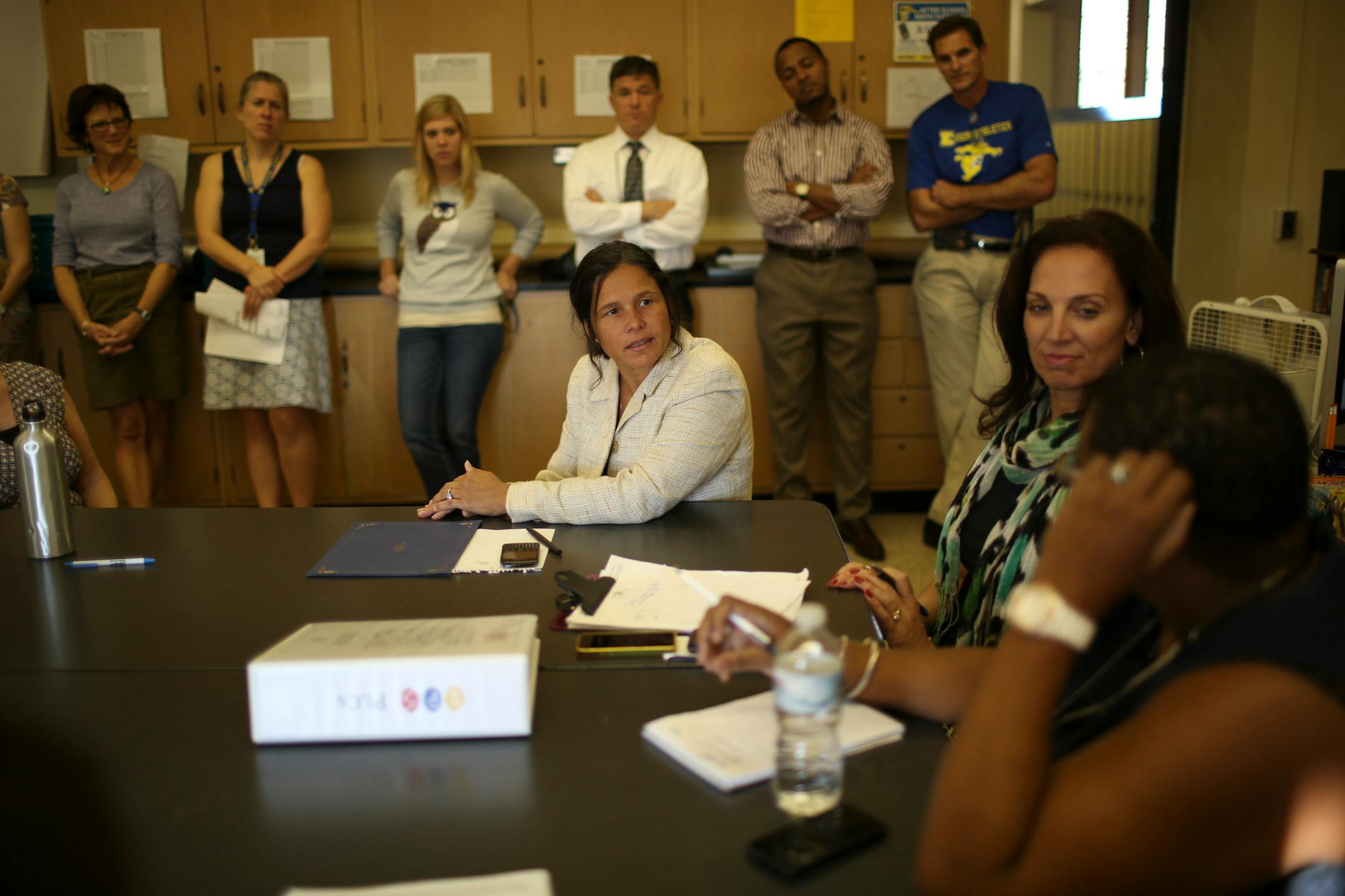 Minnesota Education Commissioner Brenda Cassellius, center, visited Edison High School in Minneapolis on Oct. 1 to congratulate staff on the school's removal from the "priority" (worst) list in Multiple Measurements Rating. She heard comments by Minneapolis public schools Superintendent Bernadeia Johnson, right. Between them was Edison High School Prinicipal Carla Steinbach.