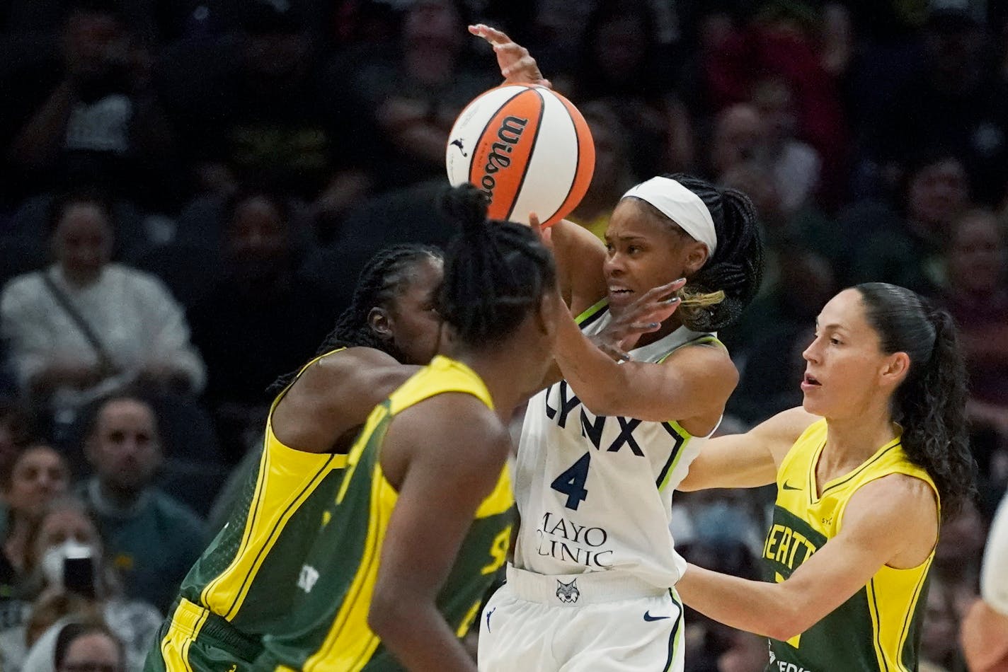 Minnesota Lynx guard Moriah Jefferson (4) tries to shoot as Seattle Storm guard Sue Bird, right, and teammates defend during the first half of a WNBA basketball game Wednesday, Aug. 3, 2022, in Seattle. (AP Photo/Ted S. Warren)