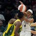 Minnesota Lynx guard Moriah Jefferson (4) tries to shoot as Seattle Storm guard Sue Bird, right, and teammates defend during the first half of a WNBA 