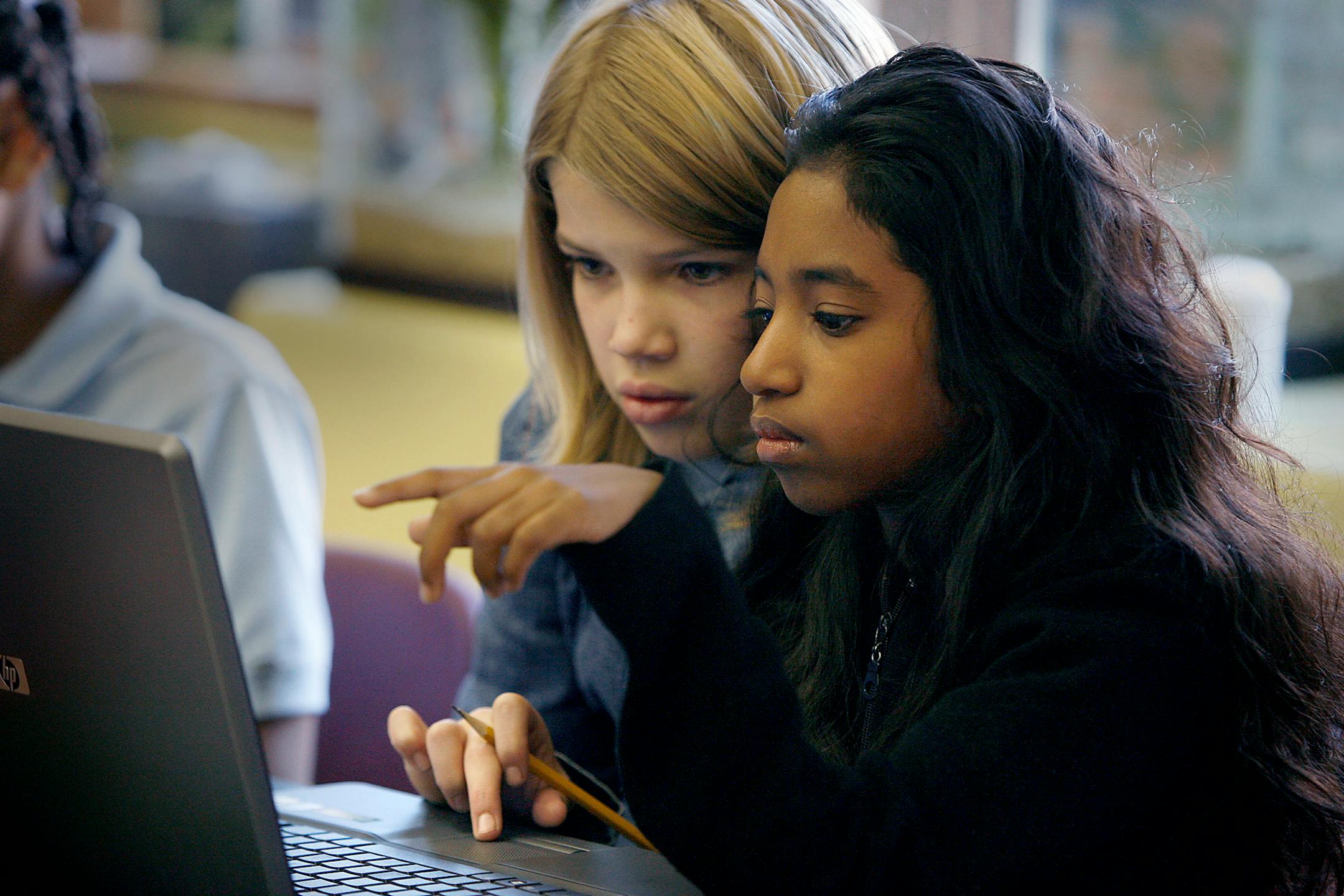 Rachel Overvig, 11, left, and Chandrika Pope, 11, worked together in "Smath," class, a 90-minute class that combines both Math and Science at the Laura Jeffrey Academy. The Academy is the first girl-focused, tuition-free public school in Minnesota and opened this fall.