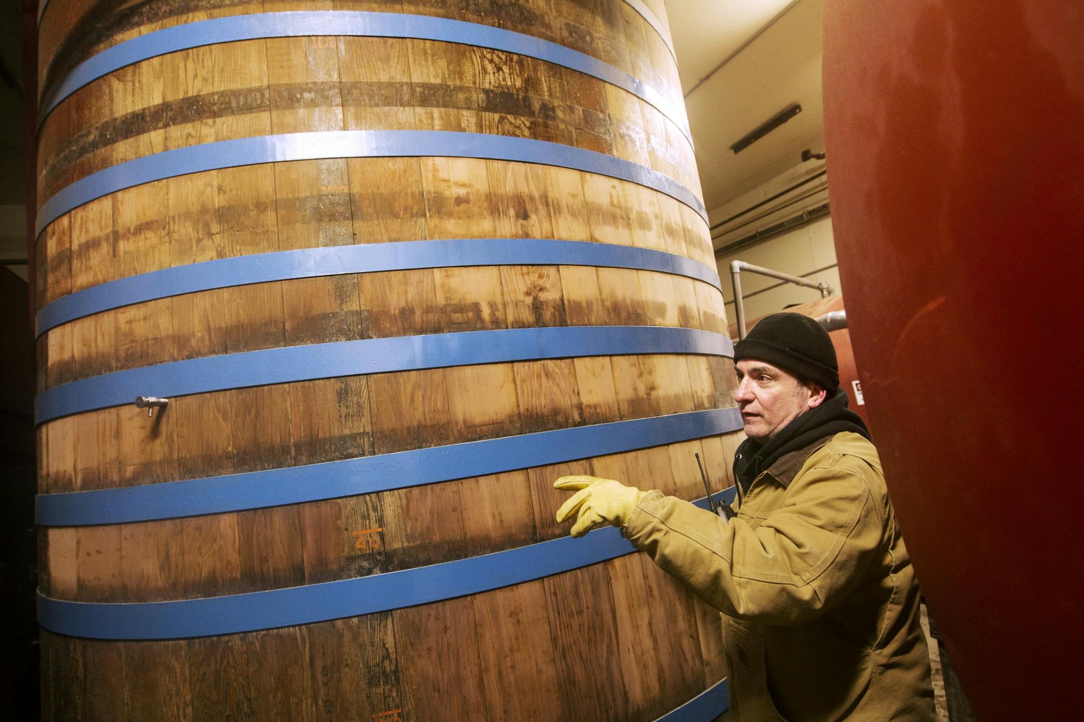 Dave Berg describes how specialty beers are brewed in cypress tanks that were brought to the brewery in 1936 at August Schell Brewing Company in New Ulm March 1, 2014.