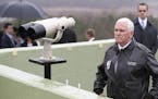 U.S. Vice President Mike Pence looks at the North side from Observation Post Ouellette in the Demilitarized Zone (DMZ), near the border village of Pan