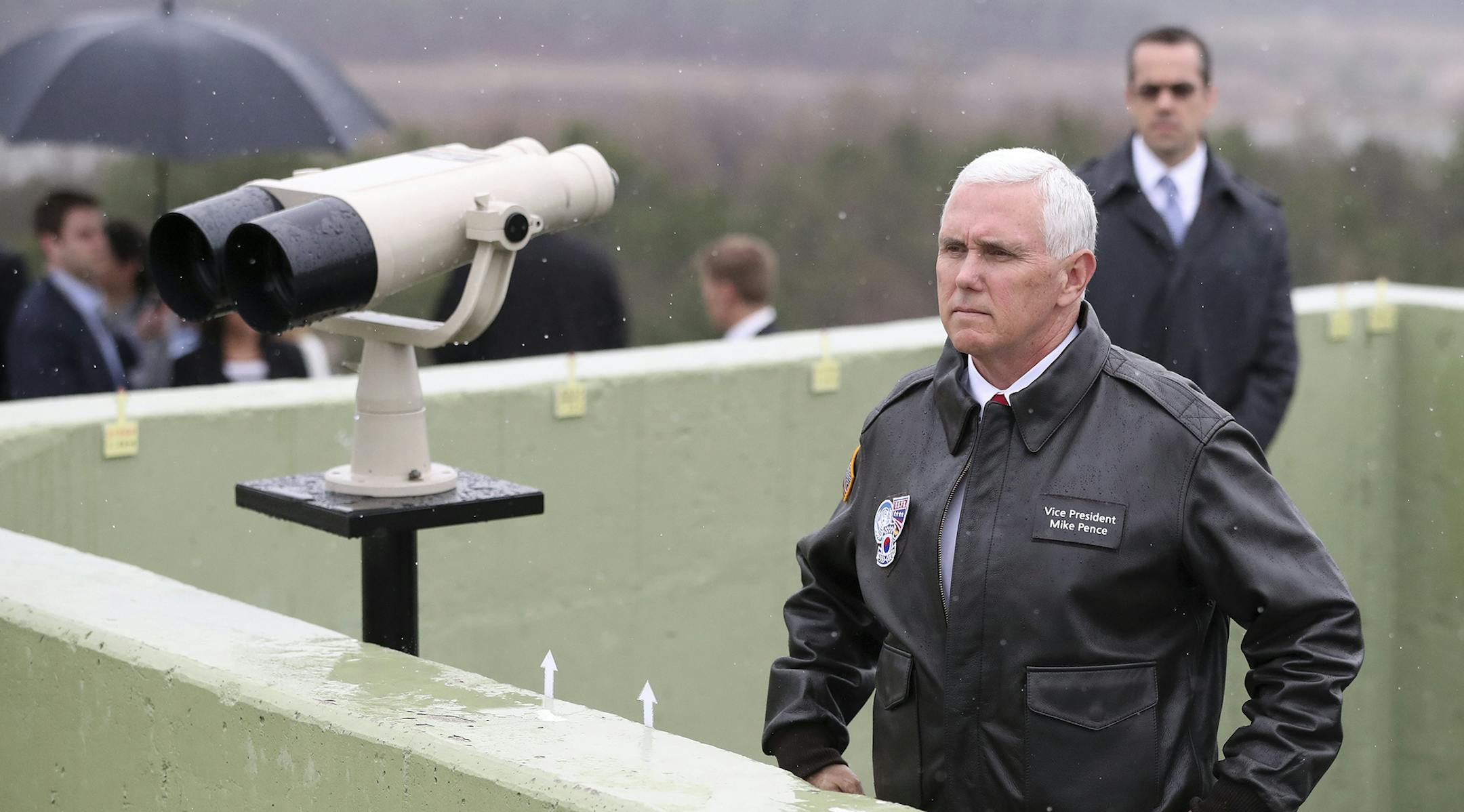 U.S. Vice President Mike Pence looks at the North side from Observation Post Ouellette in the Demilitarized Zone (DMZ), near the border village of Panmunjom, which has separated the two Koreas since the Korean War, South Korea, Monday, April 17, 2017. Viewing his adversaries in the distance, Pence traveled to the tense zone dividing North and South Korea and warned Pyongyang that after years of testing the U.S. and South Korea with its nuclear ambitions, "the era of strategic patience is over."