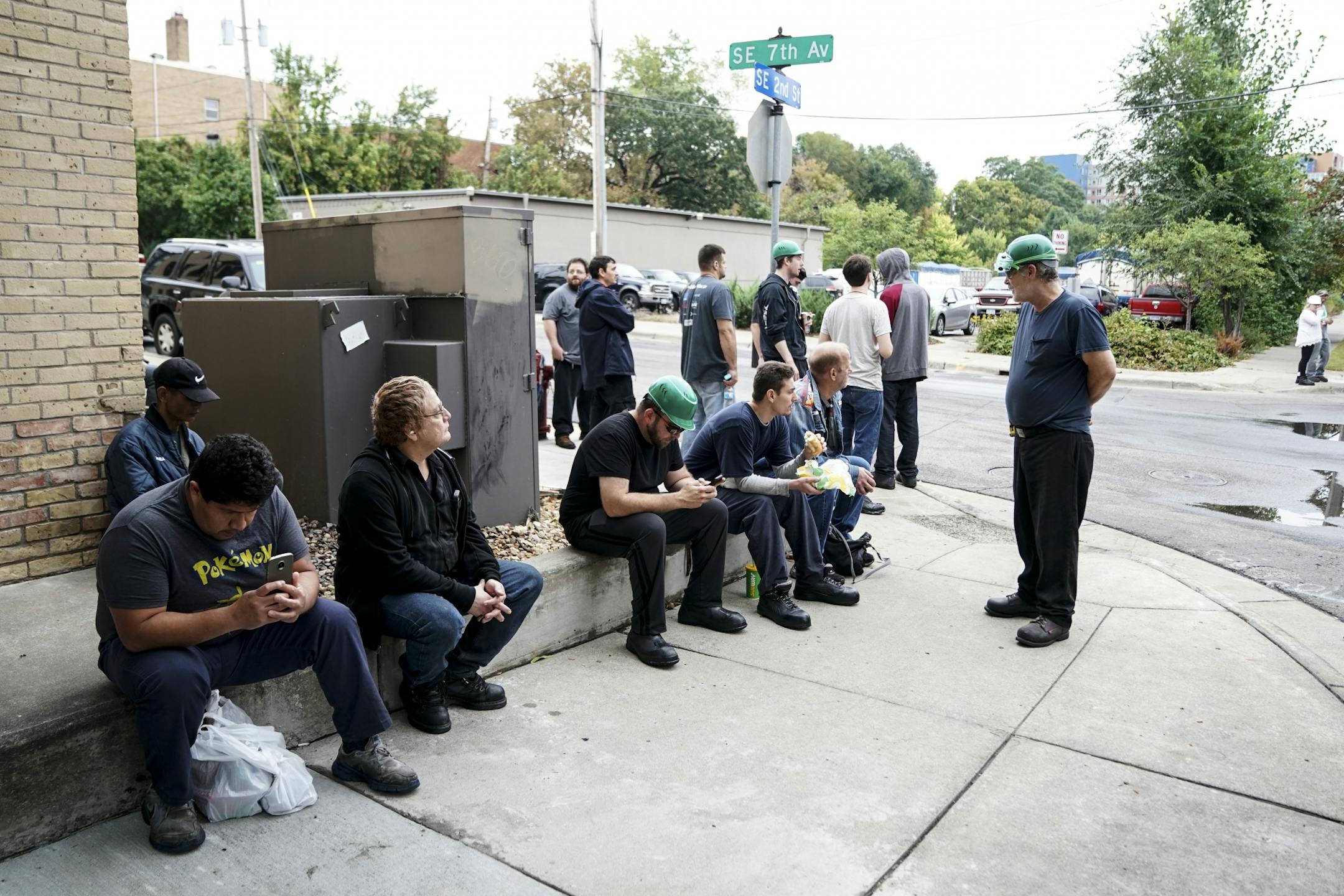 Evacuated workers waited across the street from Metal-Matic after an explosion and fire Wednesday afternoon.