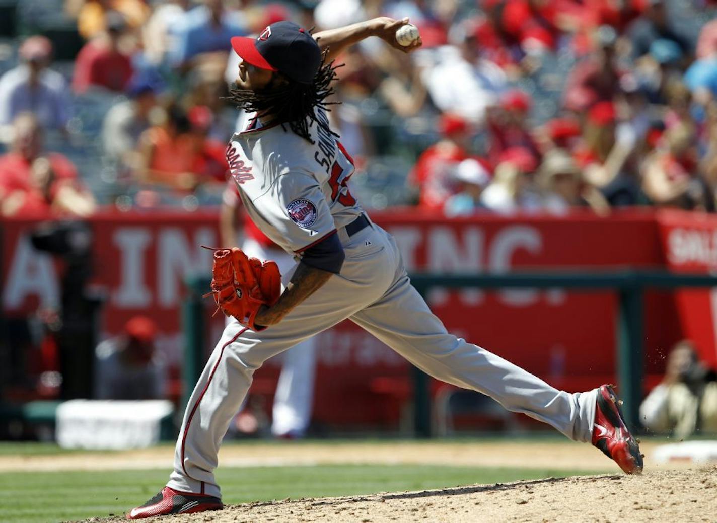 Minnesota Twins starting pitcher Ervin Santana throws against the Los Angeles Angels during the eighth inning of a baseball game in Anaheim, Calif., Thursday, July 23, 2015. Santana had seven strikeouts in eight innings as the Twins won 3-0.