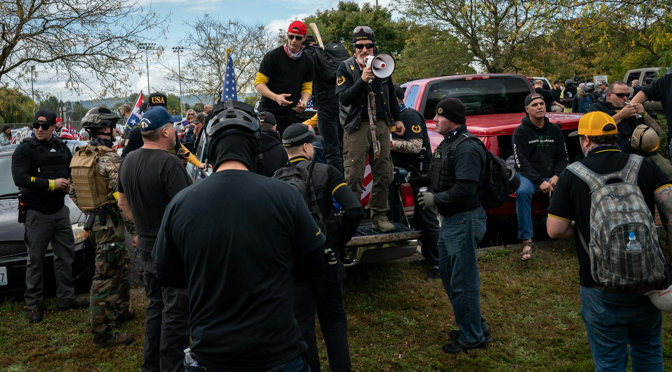Members and supporters of the Proud Boys gather in Portland, Ore., Sept. 26, 2020. During this weekÕs presidential debate, President Donald Trump said the far-right organization should Òstand back and stand by.Ó Some saw it as an endorsement of a group known for street brawls. (Diana Zeyneb Alhindawi/The New York Times)
