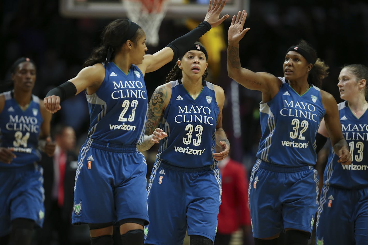 Minnesota Lynx forward Maya Moore (23) and forward Rebekkah Brunson (32) high fived over guard Seimone Augustus (33) as they headed to the bench for a late fourth quarter timeout. ] JEFF WHEELER &#xef; jeff.wheeler@startribune.com The Minnesota Lynx outlasted the Los Angeles Sparks 85-79 in a crucial Game 4 of their WNBA Finals series Sunday evening, October 16, 2016 at Staples Center in Los Angeles.