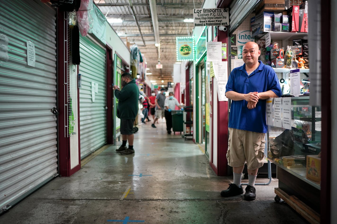 Xue Lor has always relied on foot traffic to bring business to his electronics repair shop, Lor Imports & Custom PC, in Hmong Village in St. Paul. Yet that slowed when nearby food vendors closed during the state-ordered shutdown.