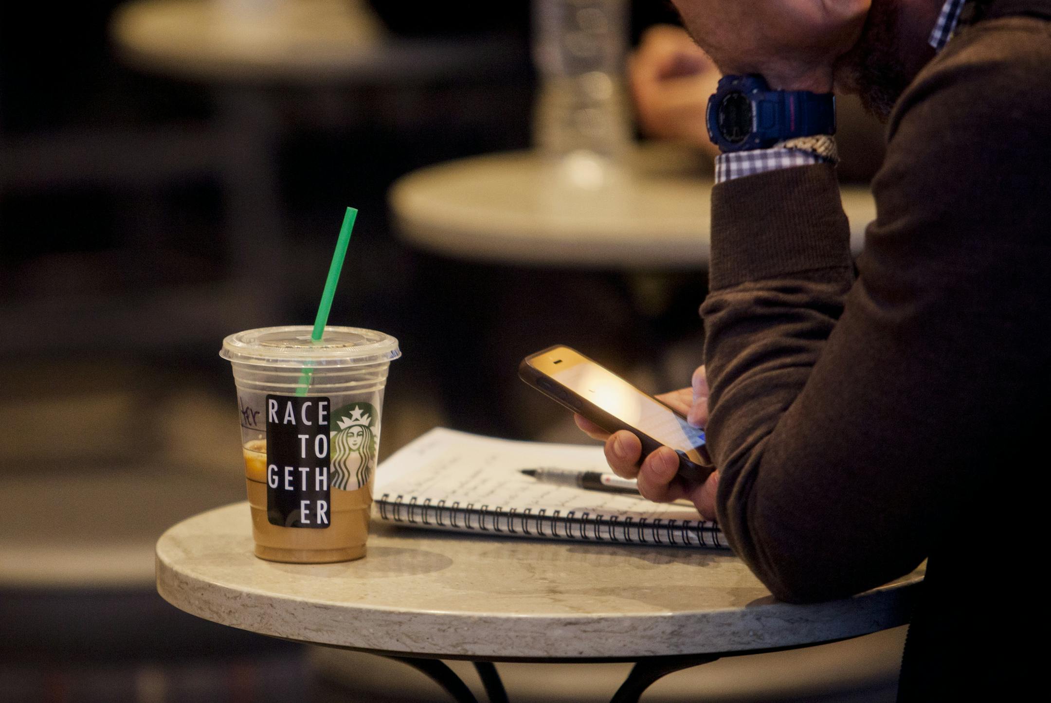 A Starbucks customer's drink with one of the chain's "race together" stickers, at a store in New York, March 18, 2015. Starbucks' "race together" initiative, intended to stimulate conversations about race relations in America, instead unleashed widespread vitriol, lighting up social media with criticism and skepticism directed at the company. (Sam Hodgson/New York Times)