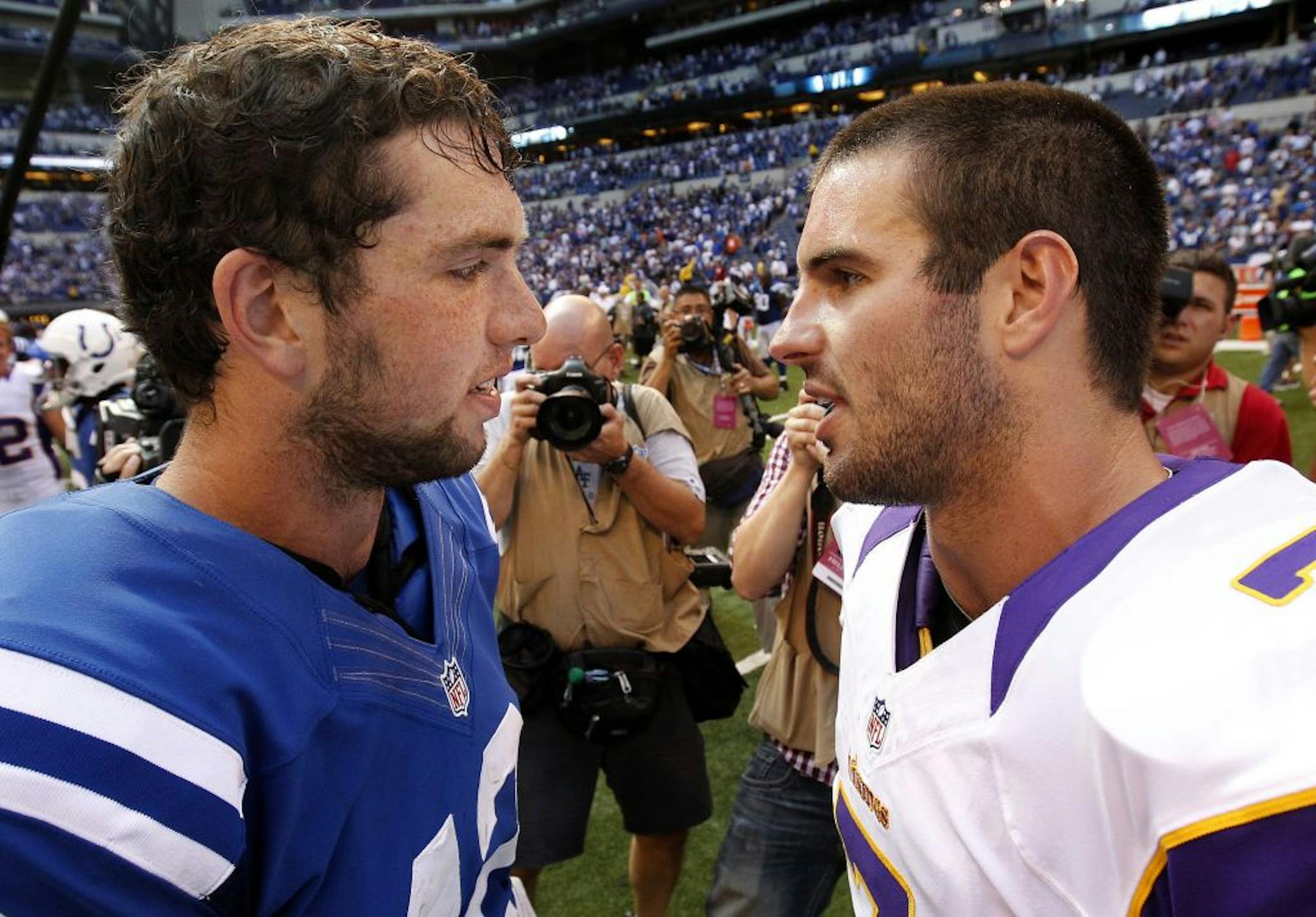 Both Andrew Luck, left, and Christian Ponder were tested Sunday, but results favored Luck in the duel of young QBs.