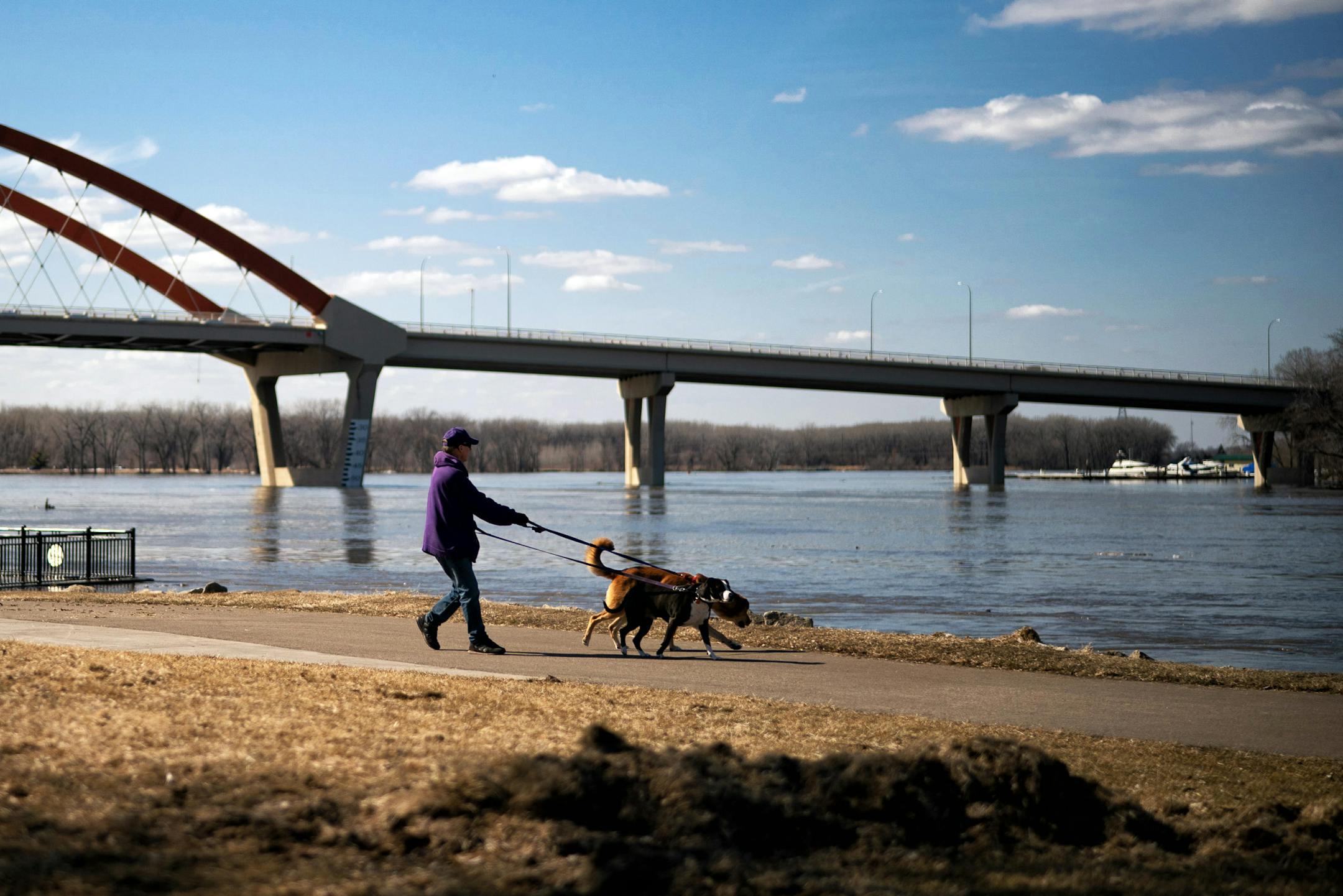 People walked along the Hastings riverfront to see the high water of the Mississippi River.