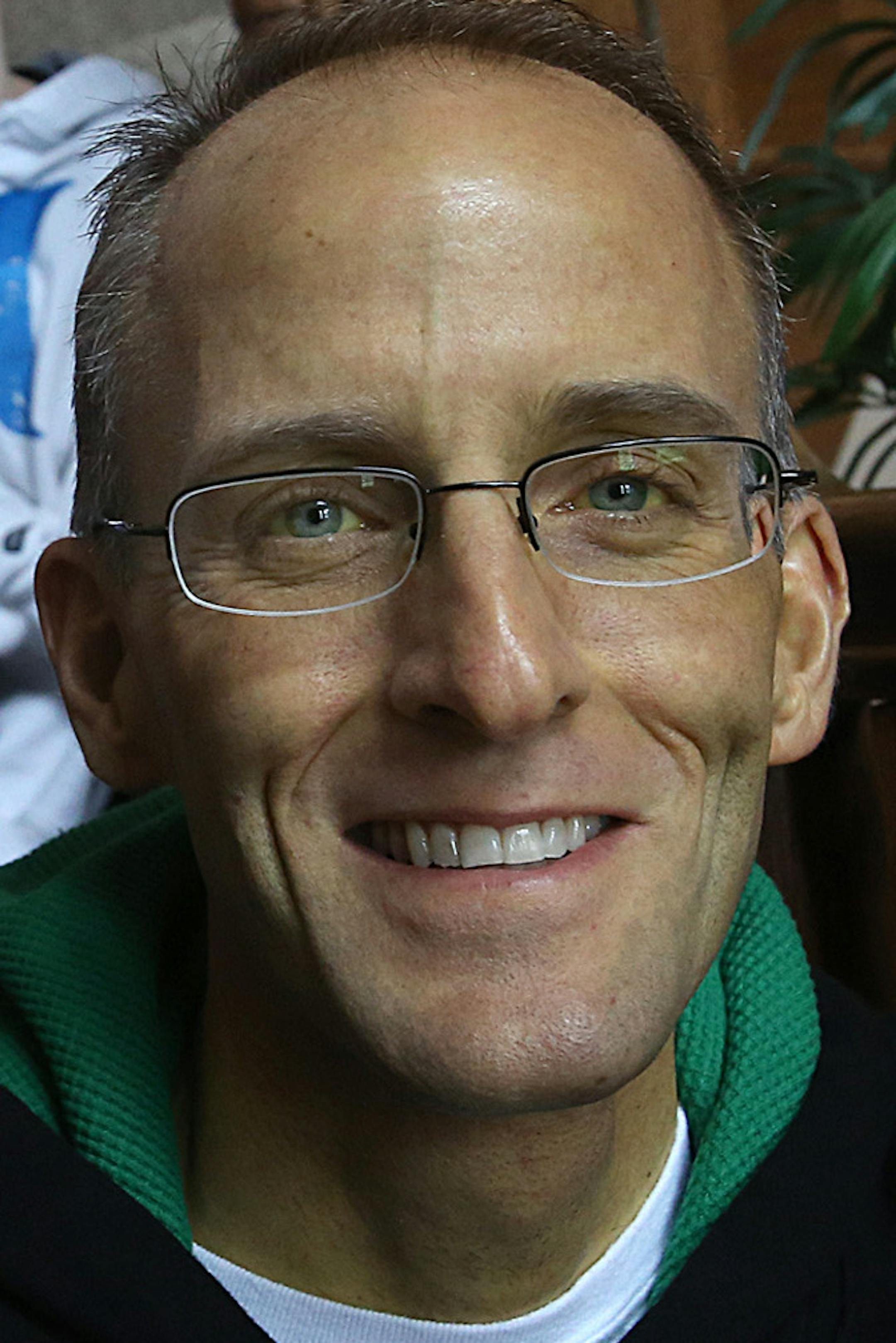 This March 26, 2013 photo shows Lt. Col. Mark Weber, his wife, Kristin, and their sons, Matthew, 17, and twins Joshua (white sweat shirt) and Noah, 12. The Minnesota National Guard officer who spoke and wrote about his battle with cancer has died. The Guard says the family confirmed he died Thursday, June 13, 2013. He was 41. Weber had been fighting Stage 4 gastrointestinal cancer for three years and wrote about his cancer battle and his challenging childhood in the self-published book, "Tell My