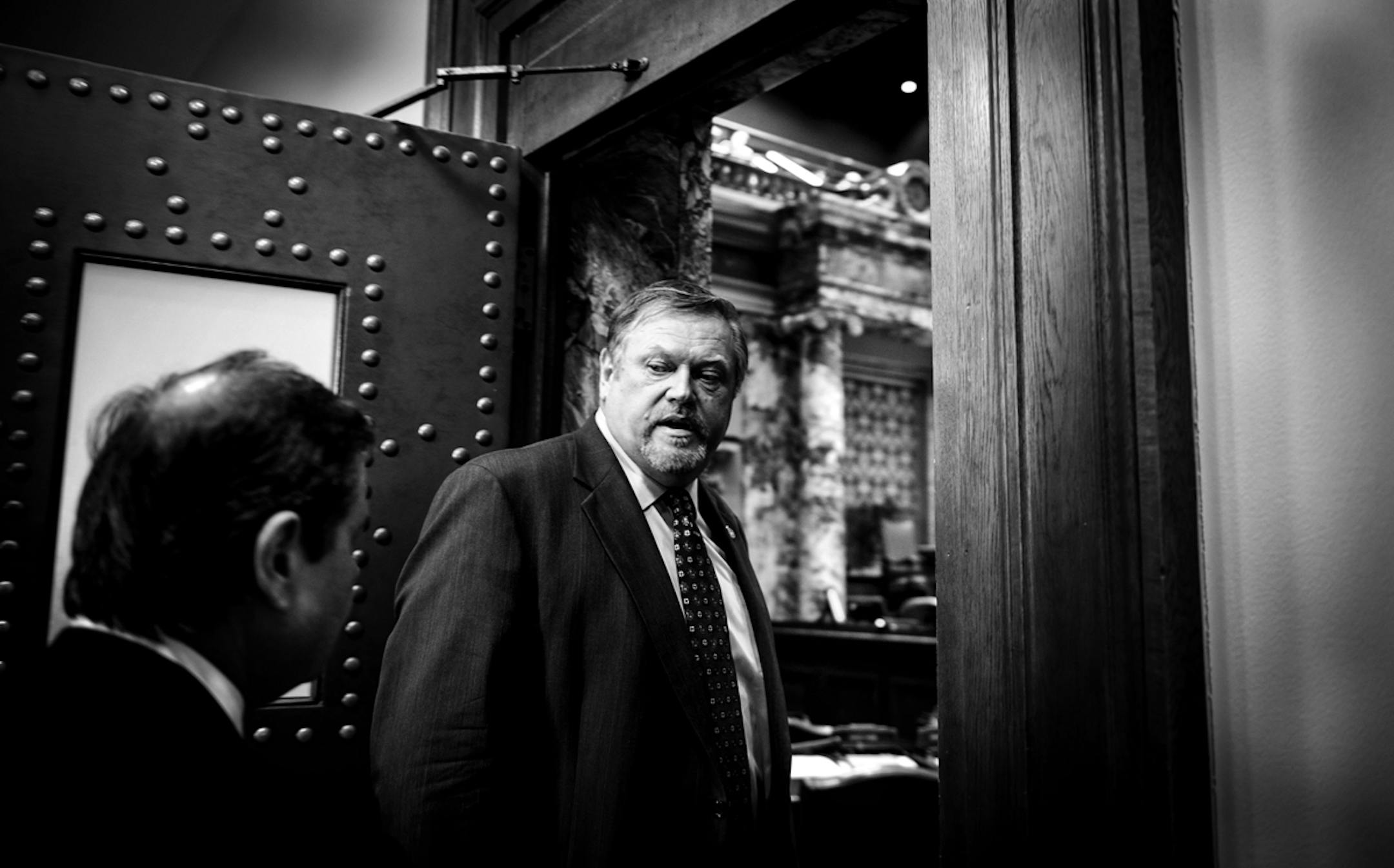 Senate Majority Leader Tom Bakk talked quickly with his chief of staff Tom Kukielka before entering the Senate floor and starting the day's session. ] GLEN STUBBE * gstubbe@startribune.com Monday, March 31, 2014.