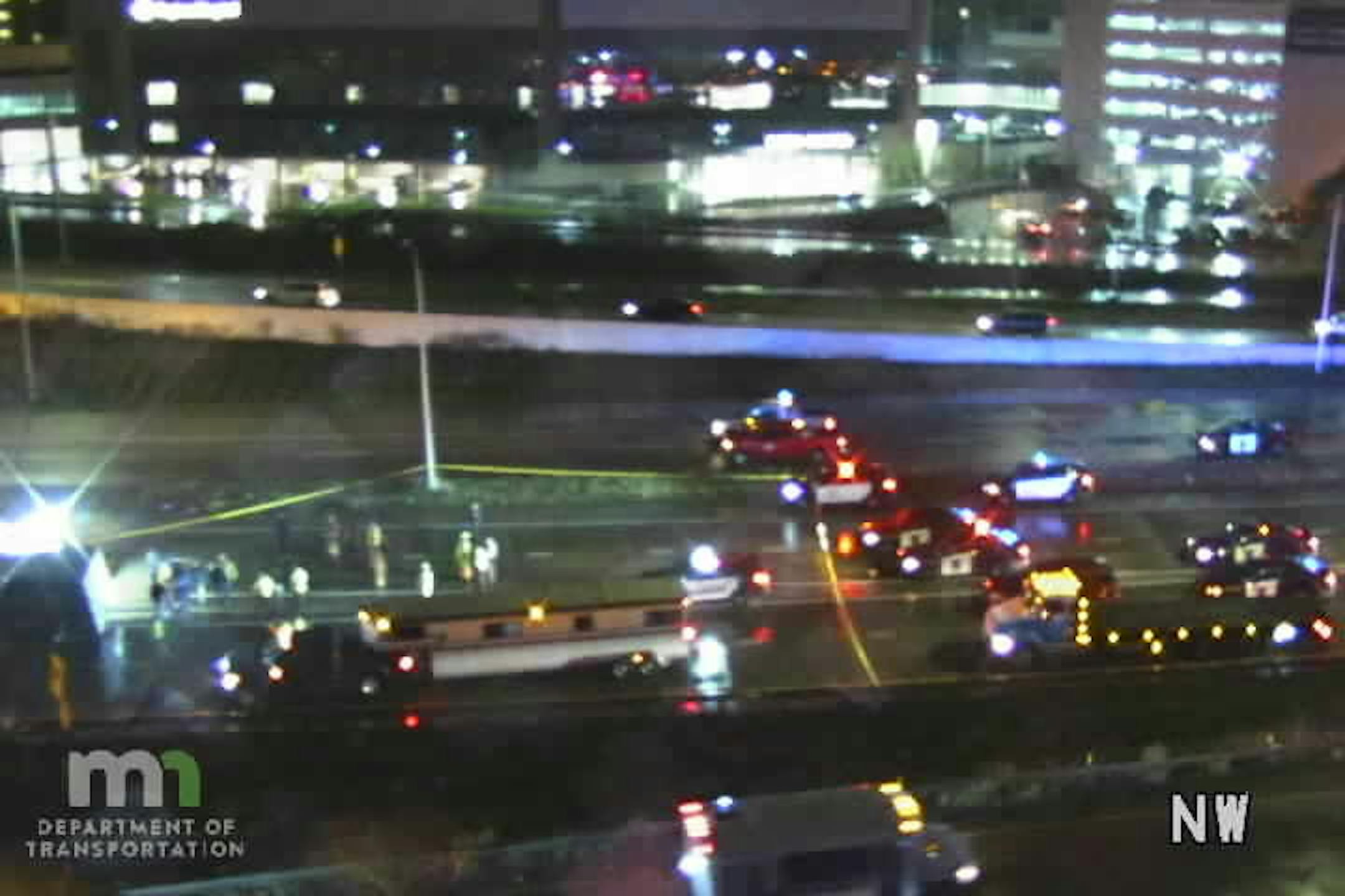 A truck towing a trailer rolled over on southbound I-35E in downtown St. Paul.