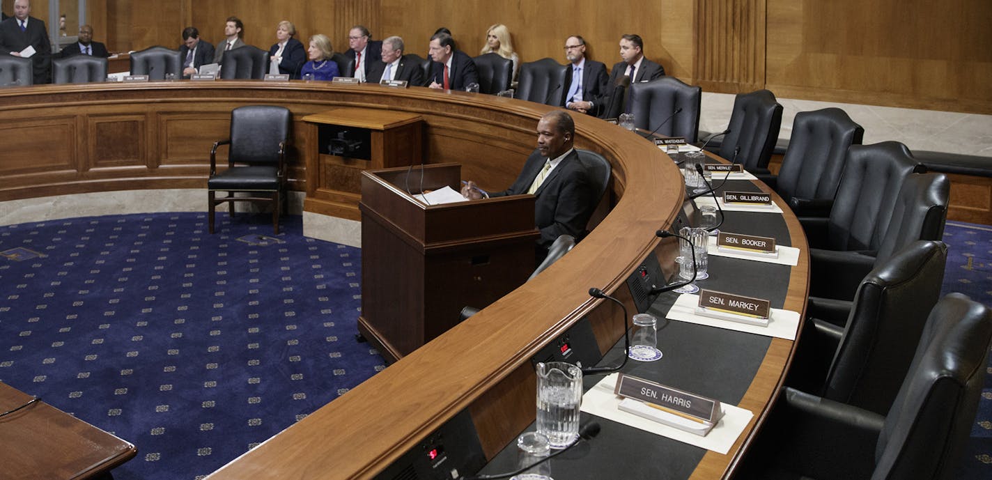 Seats on the Democrat's side of the Senate Environment and Public Works Committee hearing room are empty on Capitol Hill in Washington, Wednesday, Feb. 1, 2017, during a boycott to thwart the confirmation vote on Environmental Protection Agency (EPA) Administrator-designate Scott Pruitt. (AP Photo/J. Scott Applewhite) ORG XMIT: DCSA123