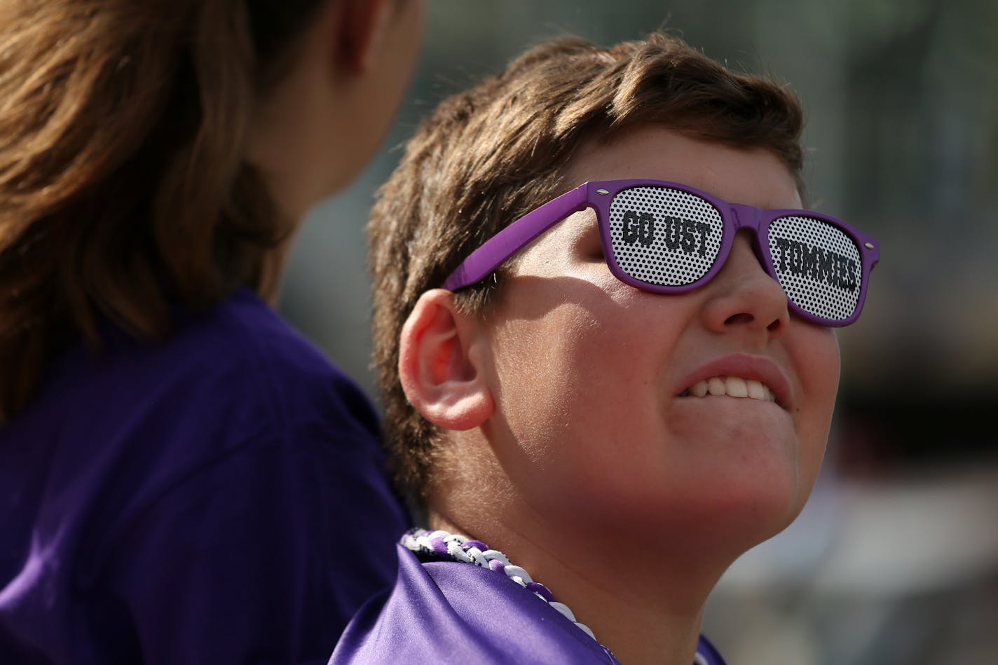 University of St. Thomas fan Harley Hohenstein, 7, of East Bethel, Minn. watched from the stands as St. John's University players warmed up prior to Saturday's game at Target Field. ] ANTHONY SOUFFLE � anthony.souffle@startribune.com Game action from an NCAA football game between the University of St. Thomas and St. John's University Saturday, Sept. 23, 2017 at Target Field in Minneapolis.