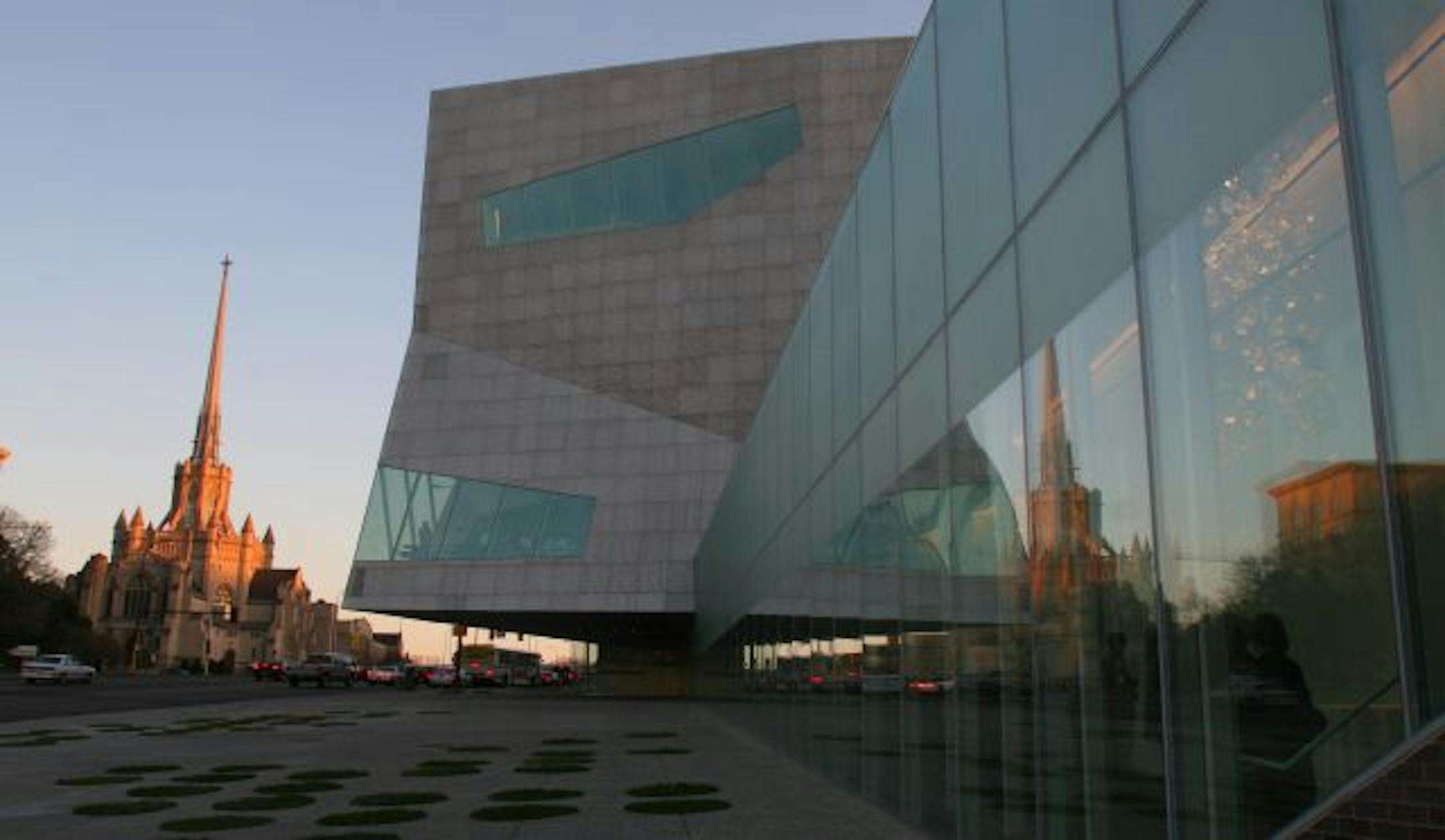 Minneapolis, MN., Thursday, 4/14/2005. Over 700 staff, friends and family members toured the new Walker Art Center addition including the Hennepin Lounge with chandeliers that look like ice cubes. From the exterior, a video wall announced the April 17th opening to the public. Comfy seats for watching videos, a talking dolphin, floors that slope like a funhouse. This is an art museum? The new Walker Art Center aims to prove that art museums don't have to be stuffy. And it succeeds. The icy exteri