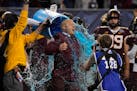 Minnesota head coach P.J. Fleck reacts after being doused during at the end of the team's Guaranteed Rate Bowl NCAA college football game against West
