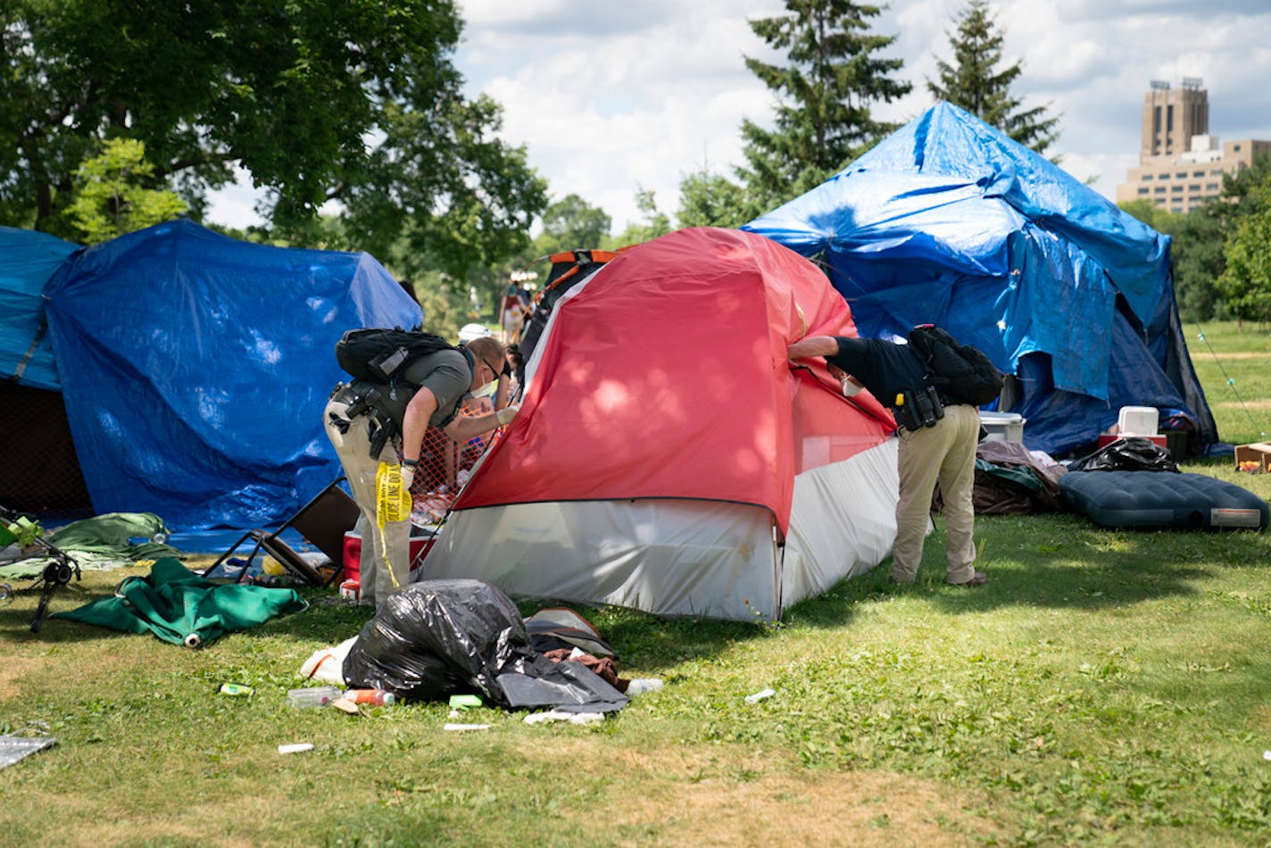 Police cleared a sprawling homeless encampment at Minneapolis' Powderhorn Park, which had swelled to several hundred people, citing increasing crime and health concerns, on July 20.