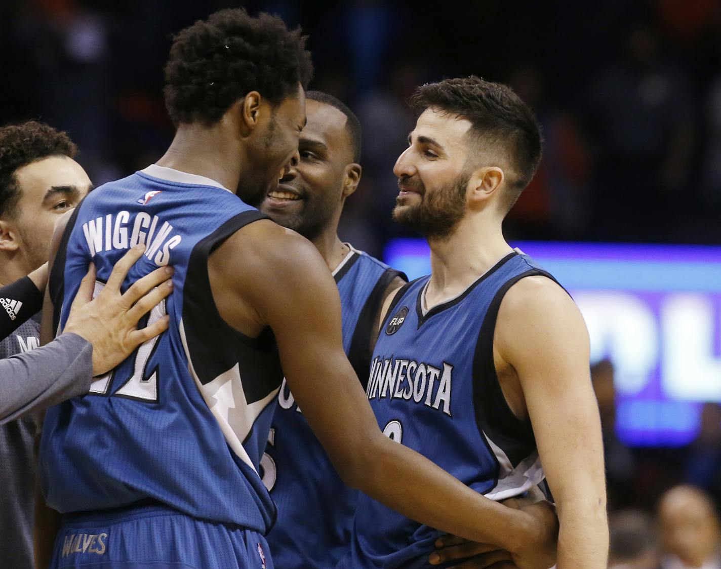 Minnesota Timberwolves guard Ricky Rubio, right, celebrates with teammate guard Andrew Wiggins, left, following an NBA basketball game against the Oklahoma City Thunder in Oklahoma City, Friday, March 11, 2016. Minnesota won 99-96. (AP Photo/Sue Ogrocki)