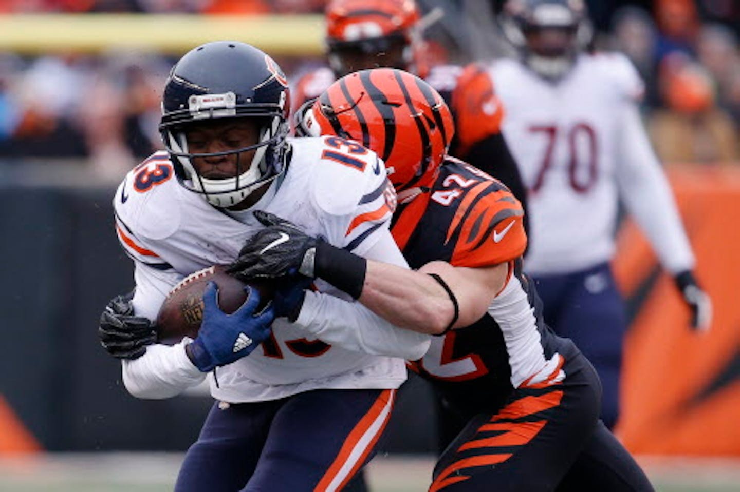 Chicago Bears wide receiver Kendall Wright (13) is tackled by Cincinnati Bengals strong safety Clayton Fejedelem (42) in the first half of an NFL football game, Sunday, Dec. 10, 2017, in Cincinnati. (AP Photo/Frank Victores) ORG XMIT: OHJMOTK