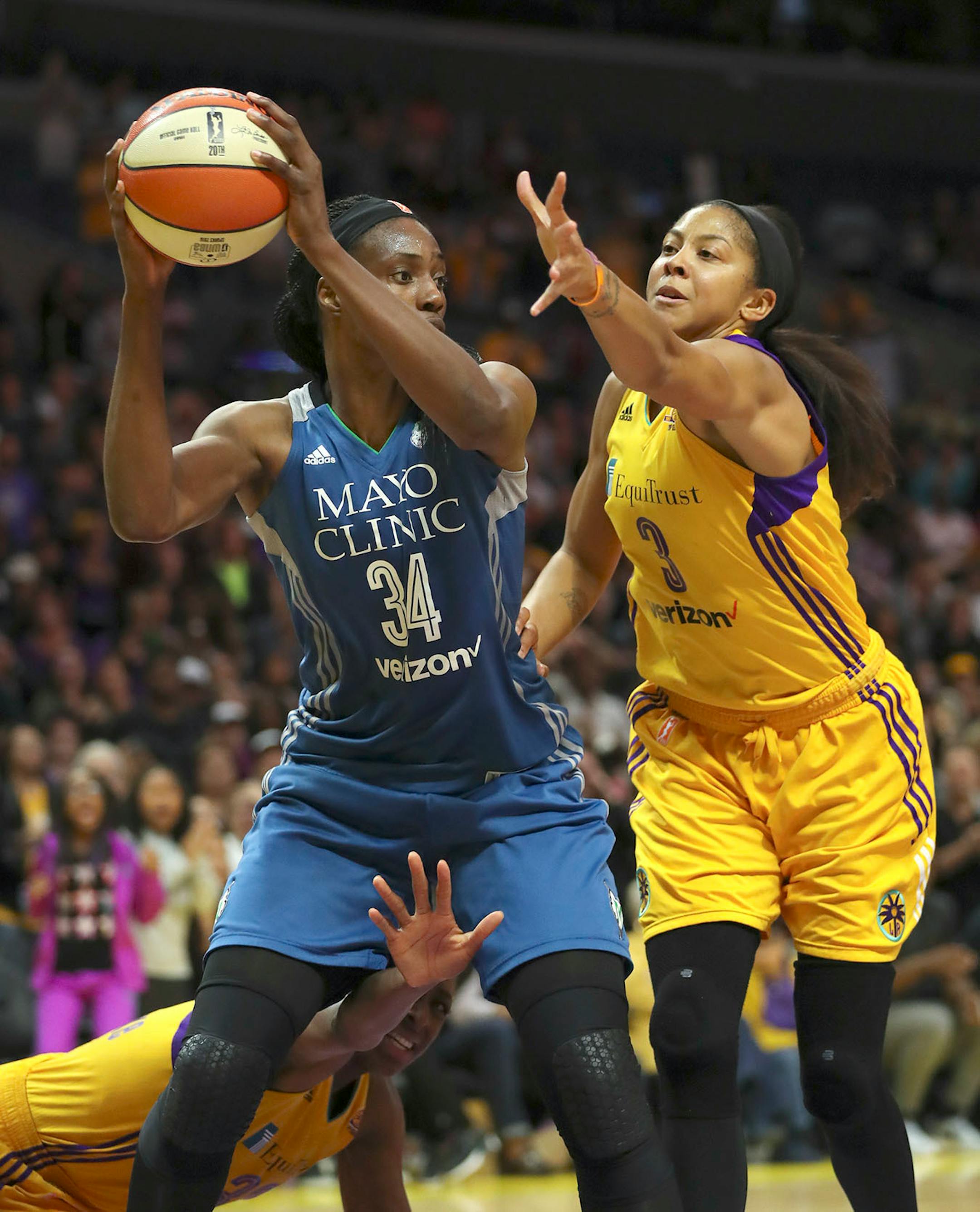 Los Angeles Sparks forward Candace Parker (3) and forward Nneka Ogwumike (30) tried to defend Minnesota Lynx center Sylvia Fowles (34) after she grabbed a loose ball under the Sparks net very late in the fourth quarter.