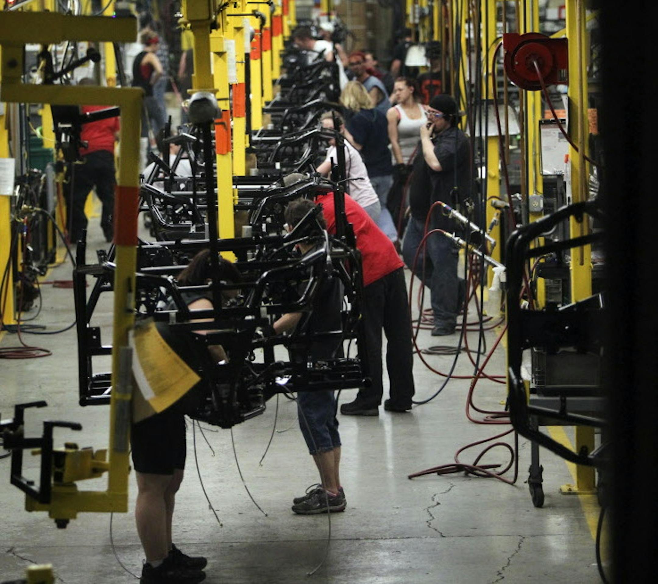 Arctic Cat line workers assemble an Arctic Cat Wildcat ATV at Arctic Cat's muanufacturing facility Wednesday, May 15, 2013 in Thief River Falls, MN. The snowmobile and ATV giant employs about 1,300 workers in Thief River Falls.](DAVID JOLES/STARTRIBUNE) djoles@startribune Pennington County is an island of growth in a sea of economic contraction in northwest Minnesota. Since 2000, job growth in the county has quadrupled population growth, making it an anomaly both statewide and in the northwest p