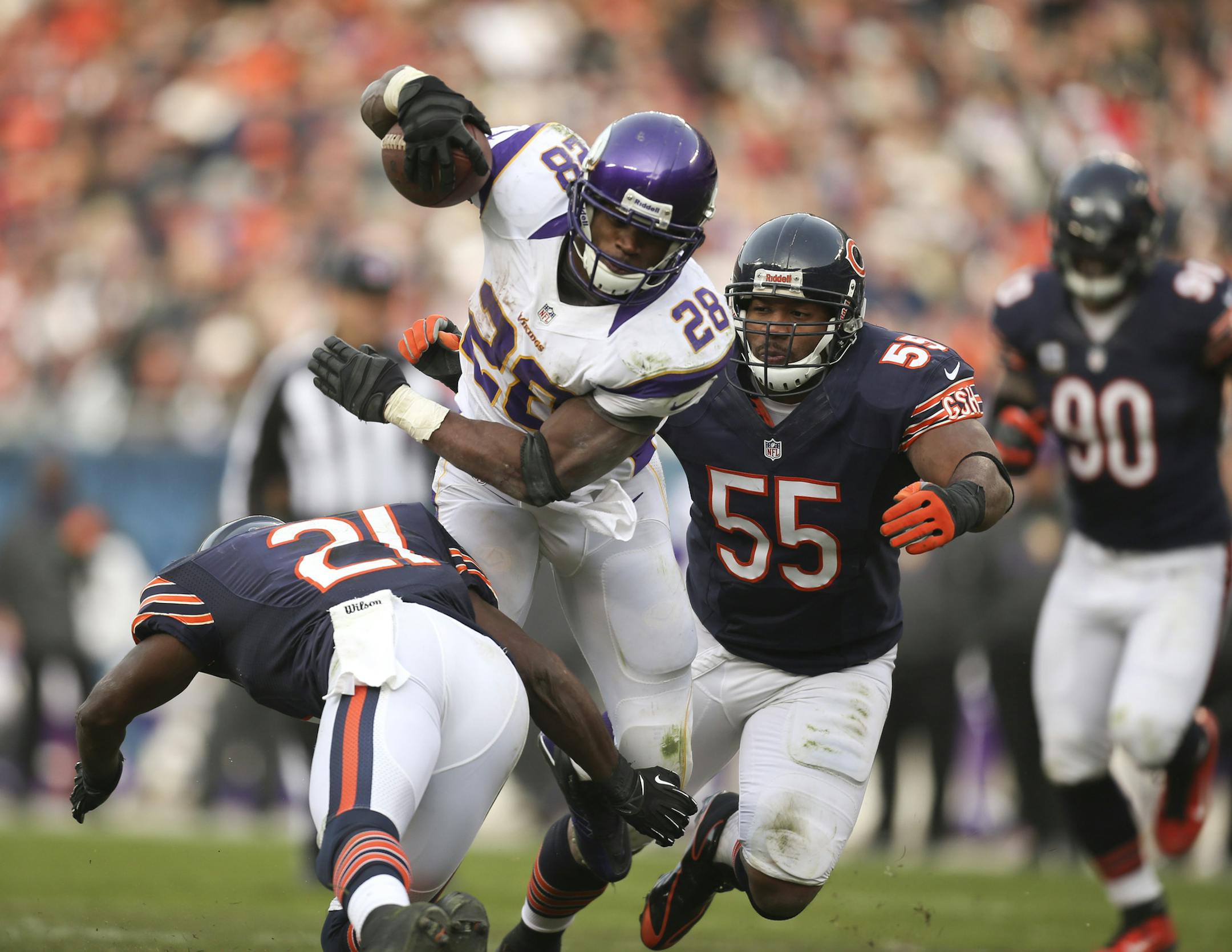 The Vikings lost to their NFC North rivals the Chicago Bears 28-10 in an NFL football game at Soldier Field in Chicago, IL Sunday afternoon, November 25, 2012. The Vikings' Adrian Peterson dodged a hit by Chicago's Major Wright early in the fourth quarter while gaining eight yards before being tackled by Lance Briggs at the Chicago eight yard line. ] JEFF WHEELER ‚Ä¢ jeff.wheeler@startribune.com ORG XMIT: MIN1211251617450048