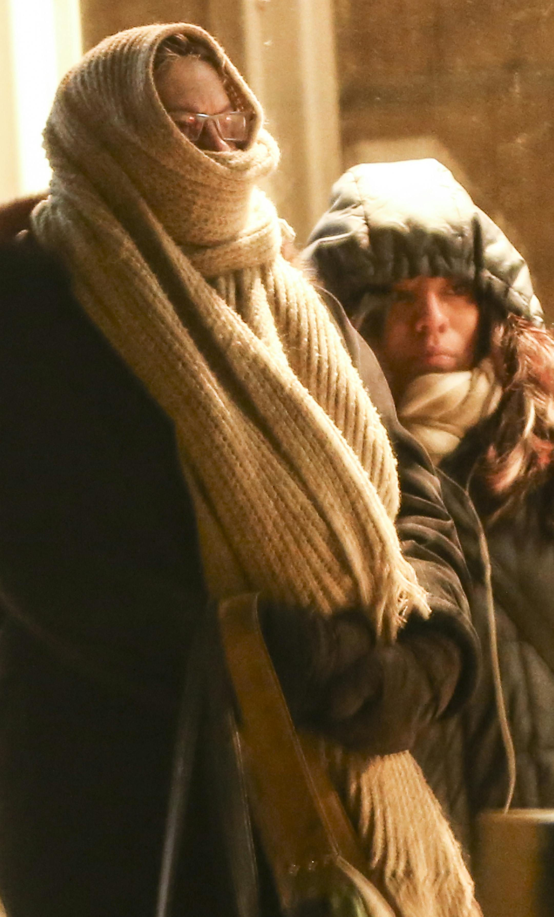 A woman wrapped her face while waiting at the bus stop on a chilly Monday evening on December 29, 2014, in downtown Minneapolis, Minn. ] RENÉE JONES SCHNEIDER reneejones@startribune.com