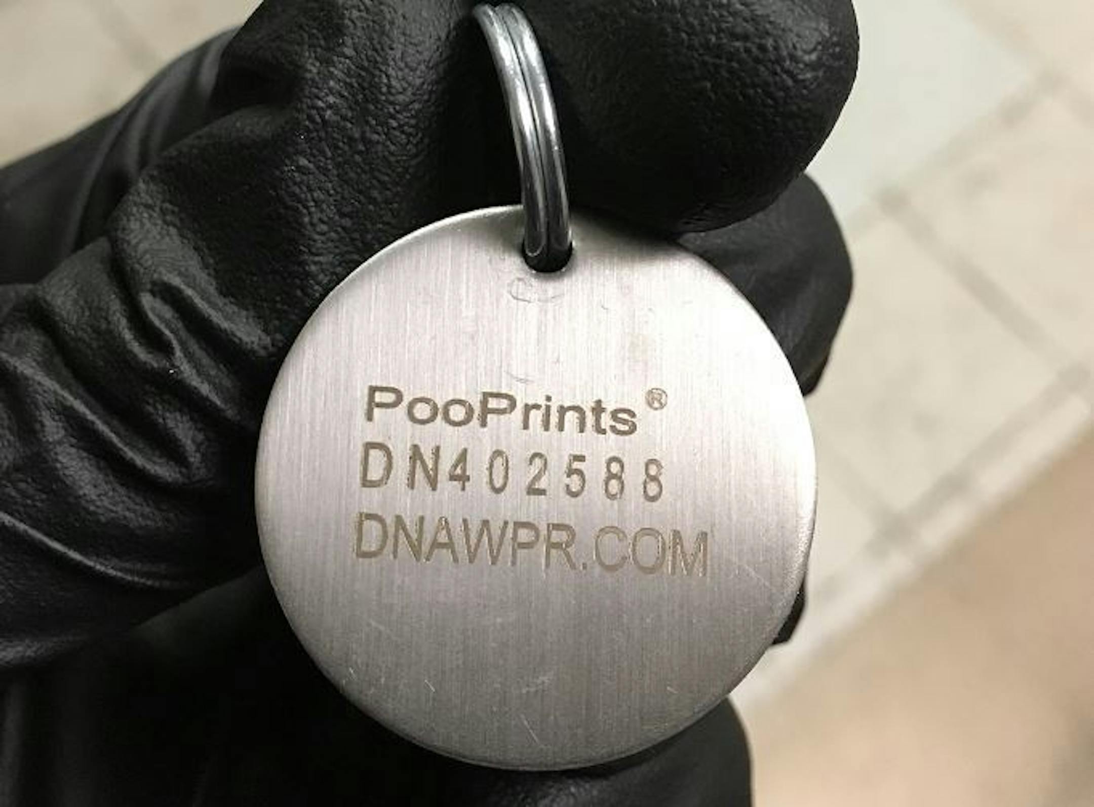 This tag helps residential building owners enforce requirements that pet owners pick up after their animals. Credit: Eagan Police Department