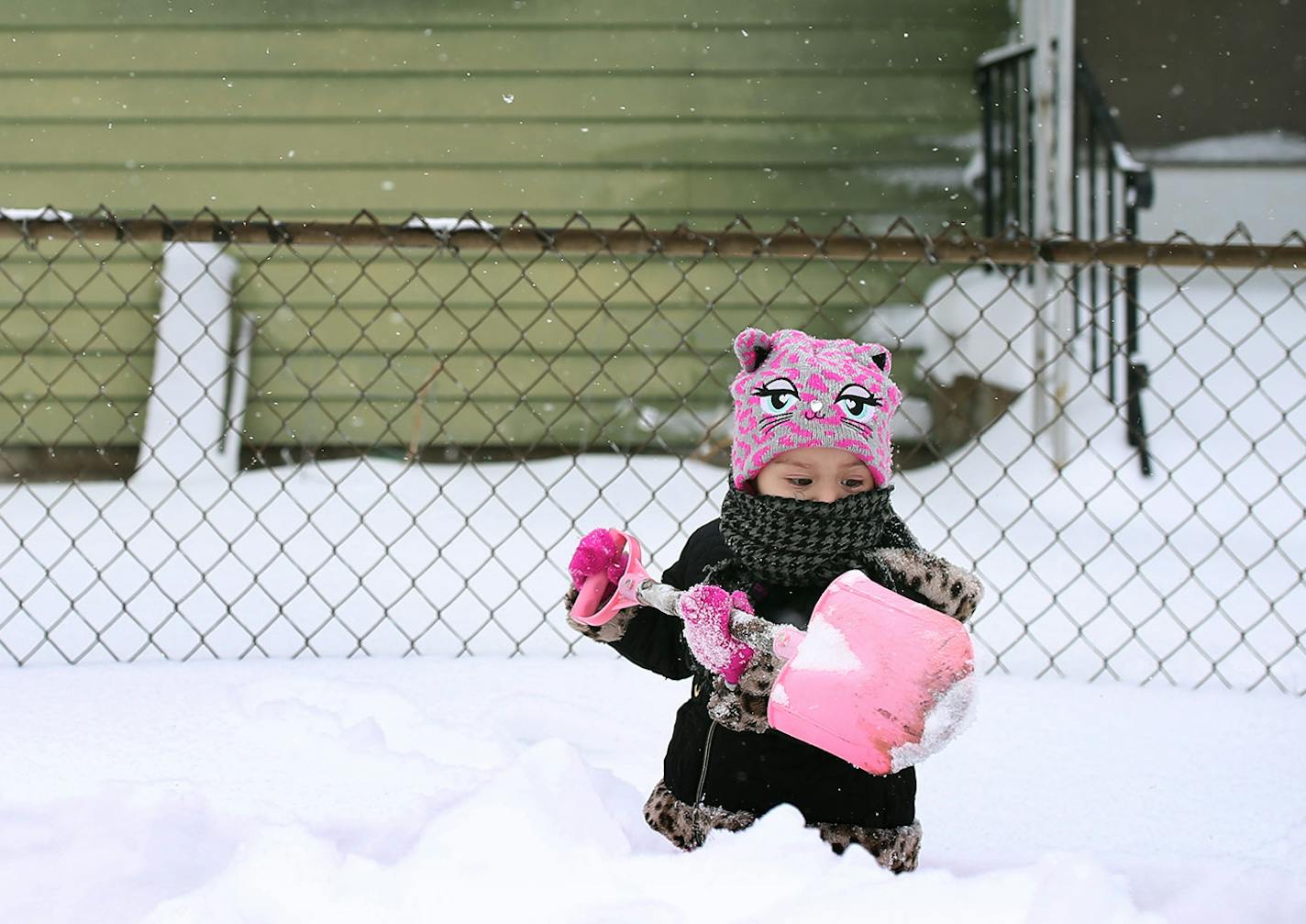 Roselyn Silvestre 2, helped shovel snow in front of her home along Penn Avenue after Saturdays blizzard Sunday April 15, 2018 in Minneapolis, MN. JERRY HOLT &#xef; jerry.holt@startribune.com