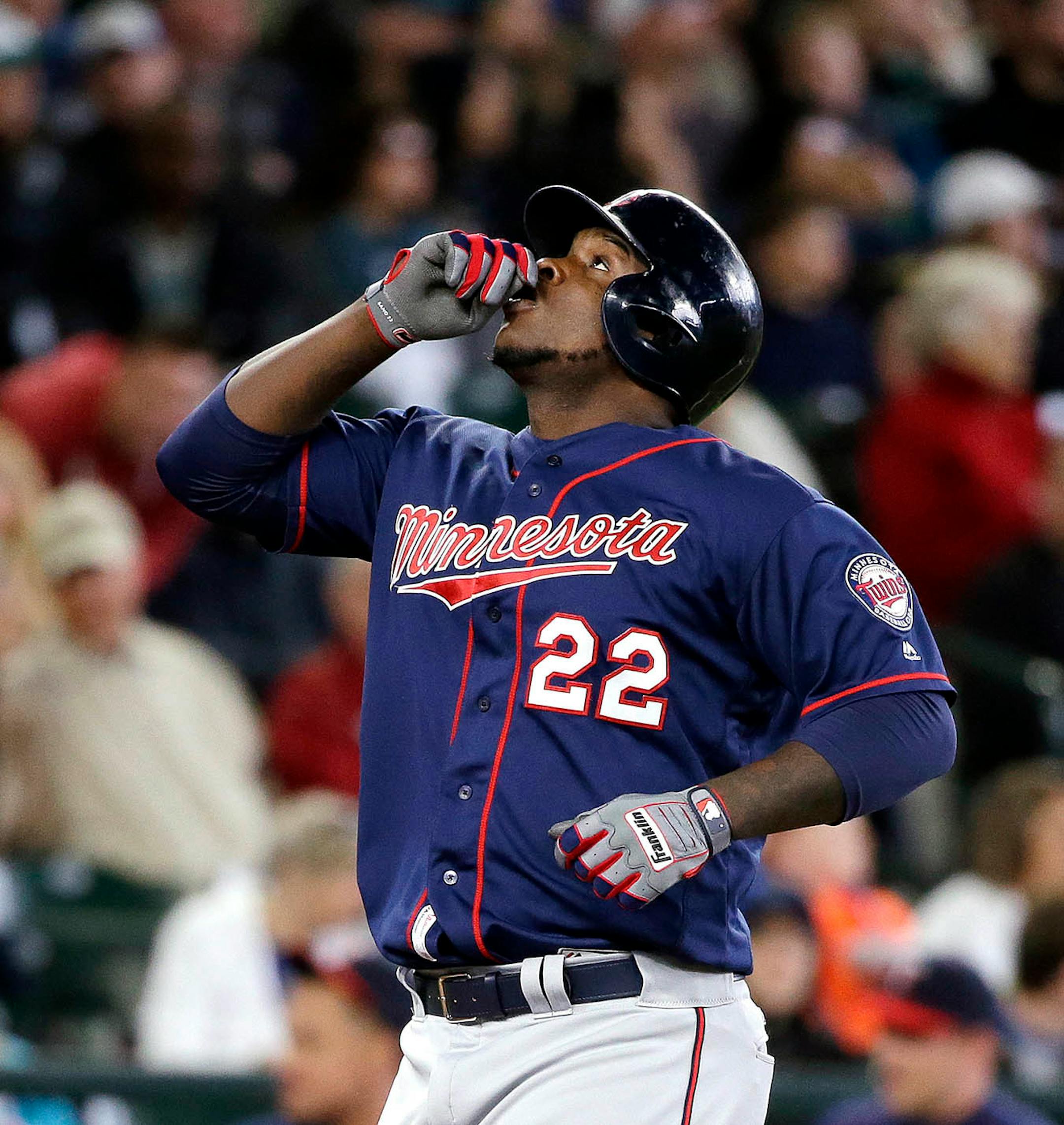 Minnesota Twins' Miguel Sano gestures before pointing skyward as he crosses home on his home run against the Seattle Mariners in the fourth inning of a baseball game Sunday, May 29, 2016, in Seattle.