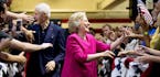 Democratic presidential candidate Hillary Clinton and her husband, former President Bill Clinton arrive for a rally at McGonigle Hall at Temple Univer