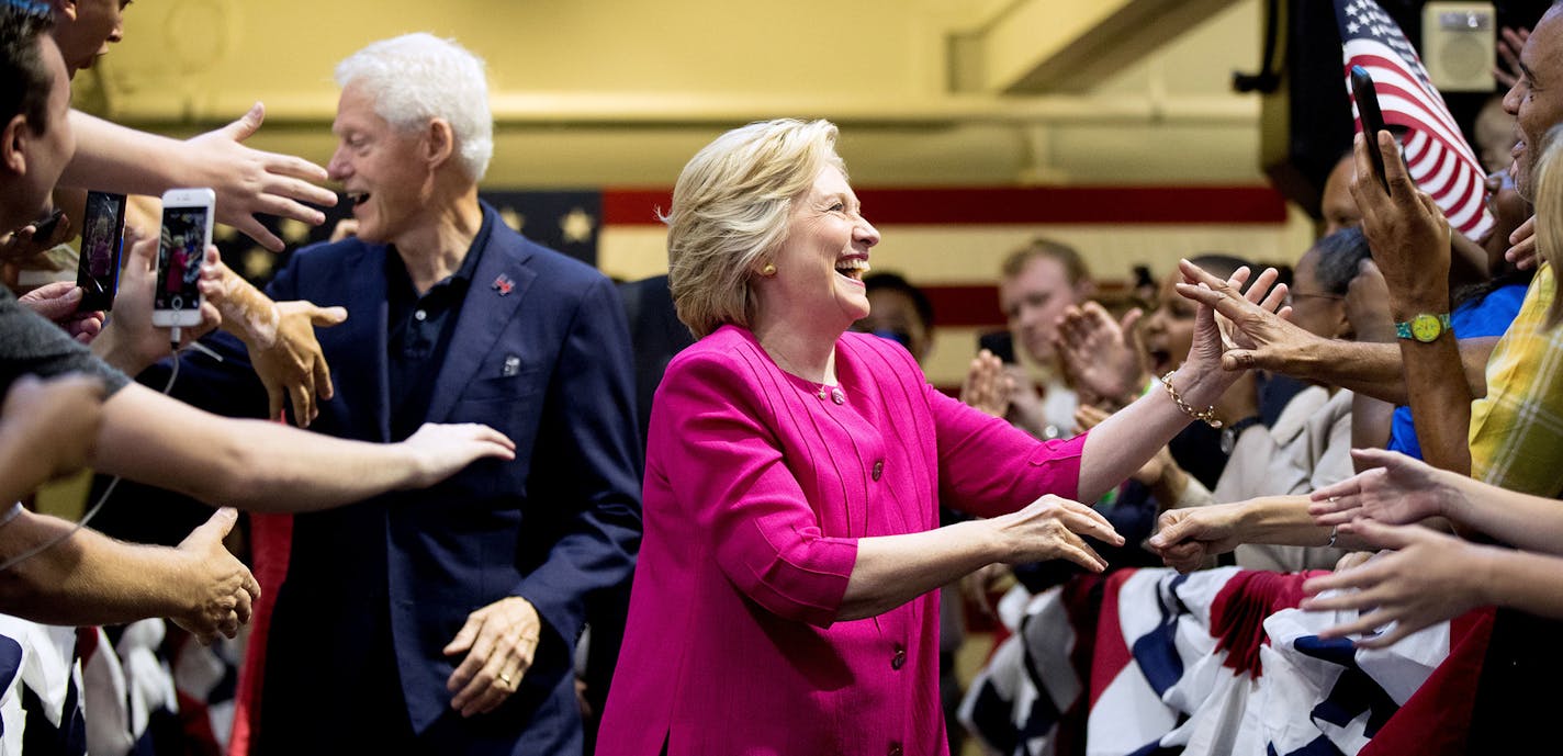 Democratic presidential candidate Hillary Clinton and her husband, former President Bill Clinton arrive for a rally at McGonigle Hall at Temple University in Philadelphia , Friday, July 29, 2016. (AP Photo/Andrew Harnik) ORG XMIT: MIN2016081913443829