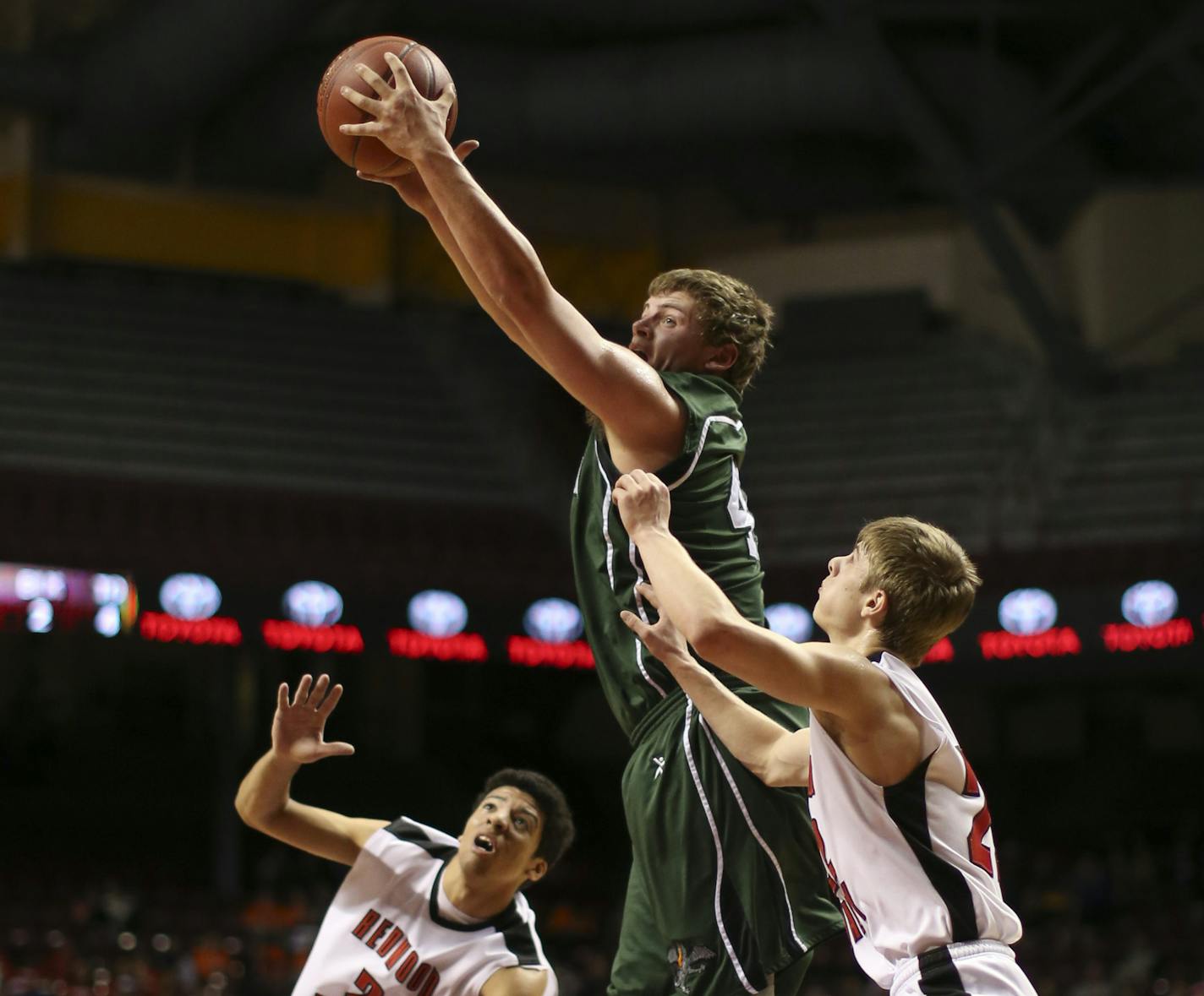 Litchfield and Redwood Valley, Redwood Falls met in the Class 2A Boys' Basketball State Tournament quarterfinal game Wednesday night, March 20, 2013 at Williams Arena in Minneapolis. Litchfield's Riley Pater took a pass in the first half between Redwood Valley, Redwood Falls defenders Taquez Perkins, left, and Mitchell Fischer. ] JEFF WHEELER &#x201a;&#xc4;&#xa2; jeff.wheeler@startribune.com