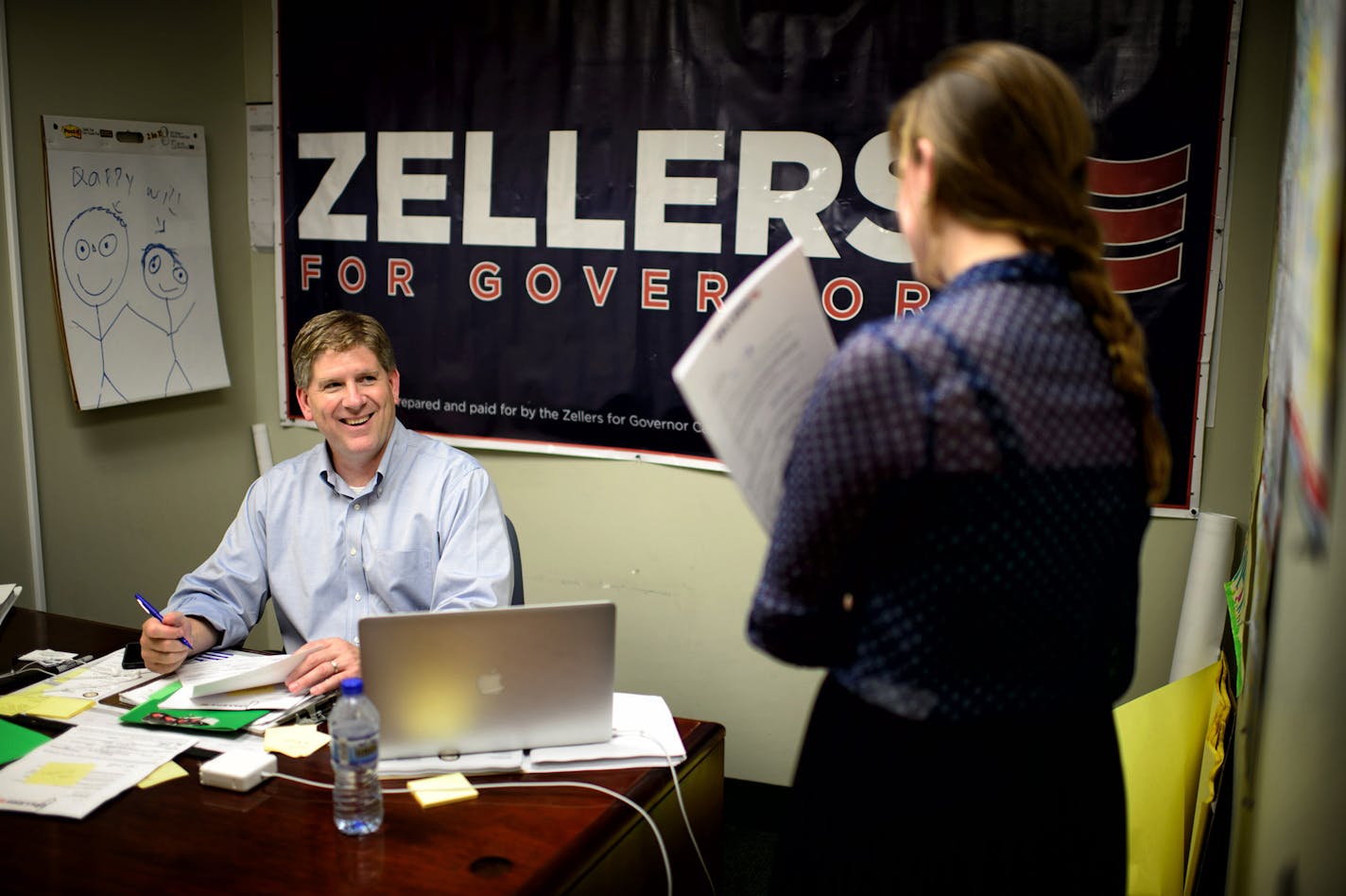 Kurt Zellers made campaign calls to primary election voters from his campaign office in Osseo. Press secretary Caitlyn Stenerson brought some thank you letters to sign. July 8, 2014 ] GLEN STUBBE * gstubbe@startribune.com ORG XMIT: MIN1407091330500363