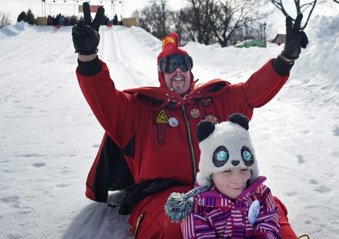 At the Winter Carnival's Vulcan Fun Day held at the Minnesota State Fair held in Falcon Heights, children Such as Katie Folie,6, enjoyed sledding with the Vulcans.] rtsong-taatarii@startribune.com/ Richard Tsong-Taatarii