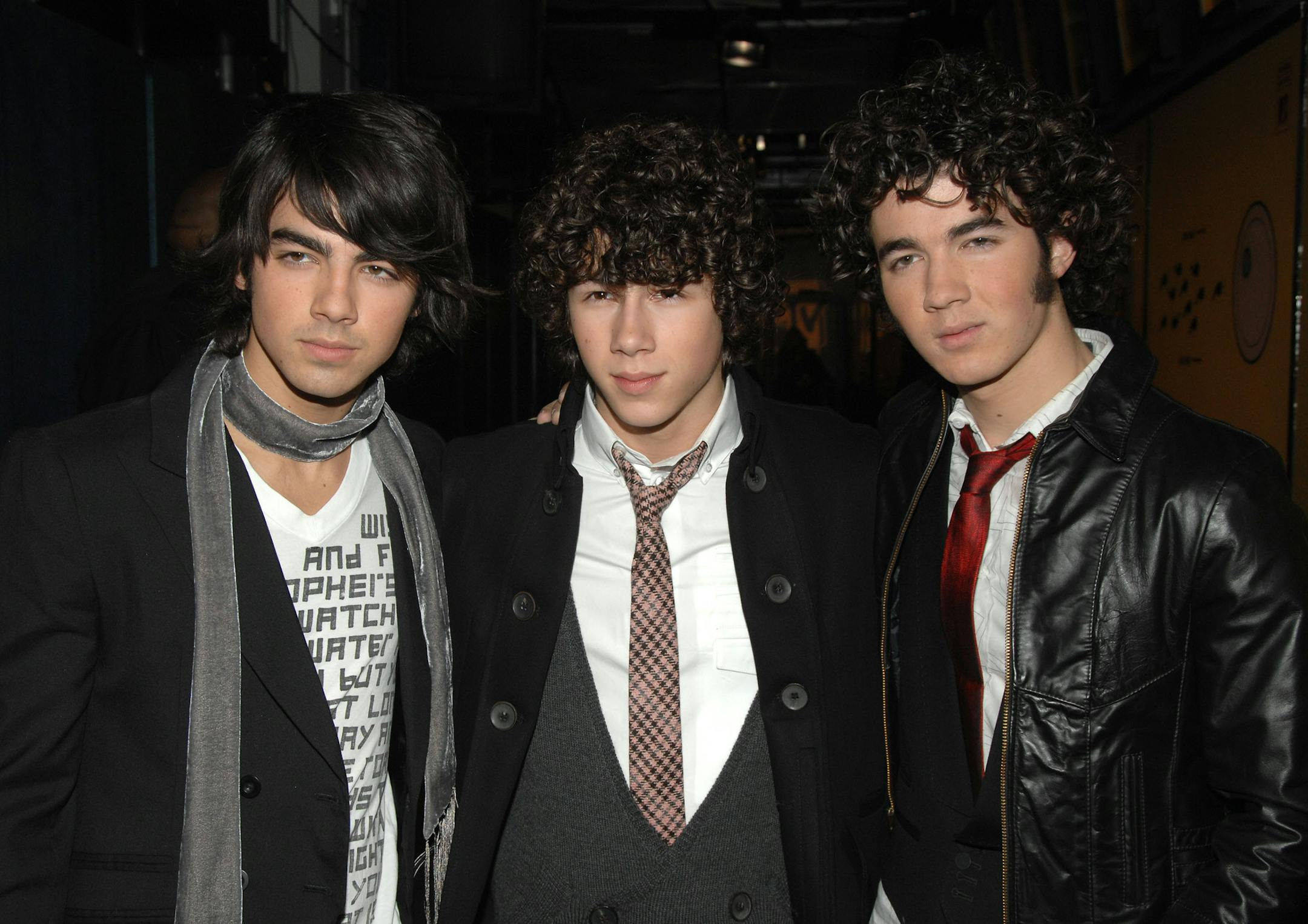 FILE - This Nov. 13, 2007 file photo shows Joe Jonas, left, Nick Jonas and Kevin Jonas, right, of the music group The Jonas Brothers at MTV Studios in Times Square in New York. The band announced Tuesday, Oct. 19, 2013, they're ending their highly successful run. The news comes after the brothers abruptly canceled their tour over creative differences earlier this month. (AP Photo/Peter Kramer, File)