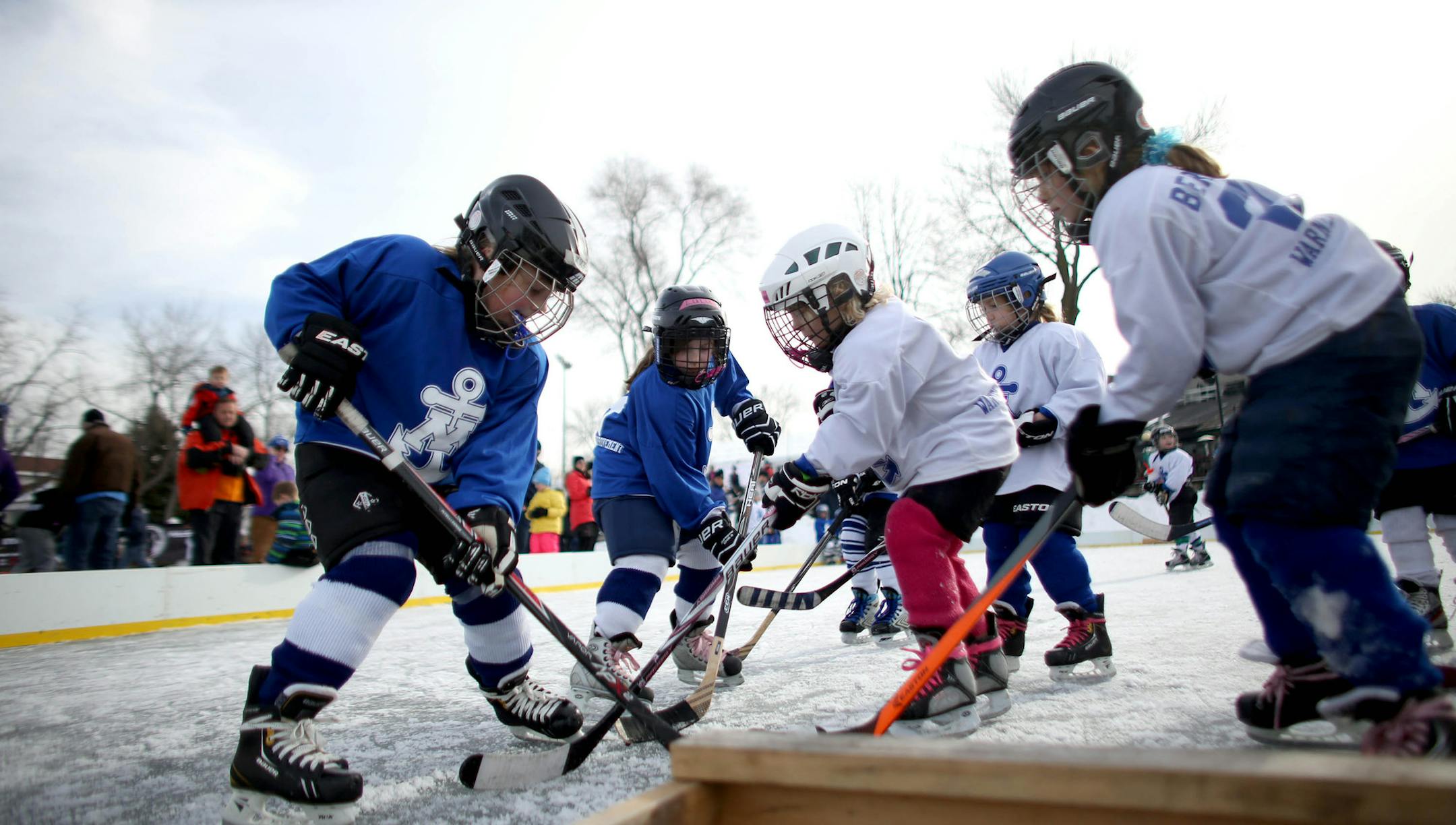 Minnetonka U6 girls went after the puck. ] (KYNDELL HARKNESS/STAR TRIBUNE) kyndell.harkness@startribune.com North American Pond Hockey Championship in Excelsior Min., Saturday, January 24, 2015. The Raptors are a special needs hockey team.