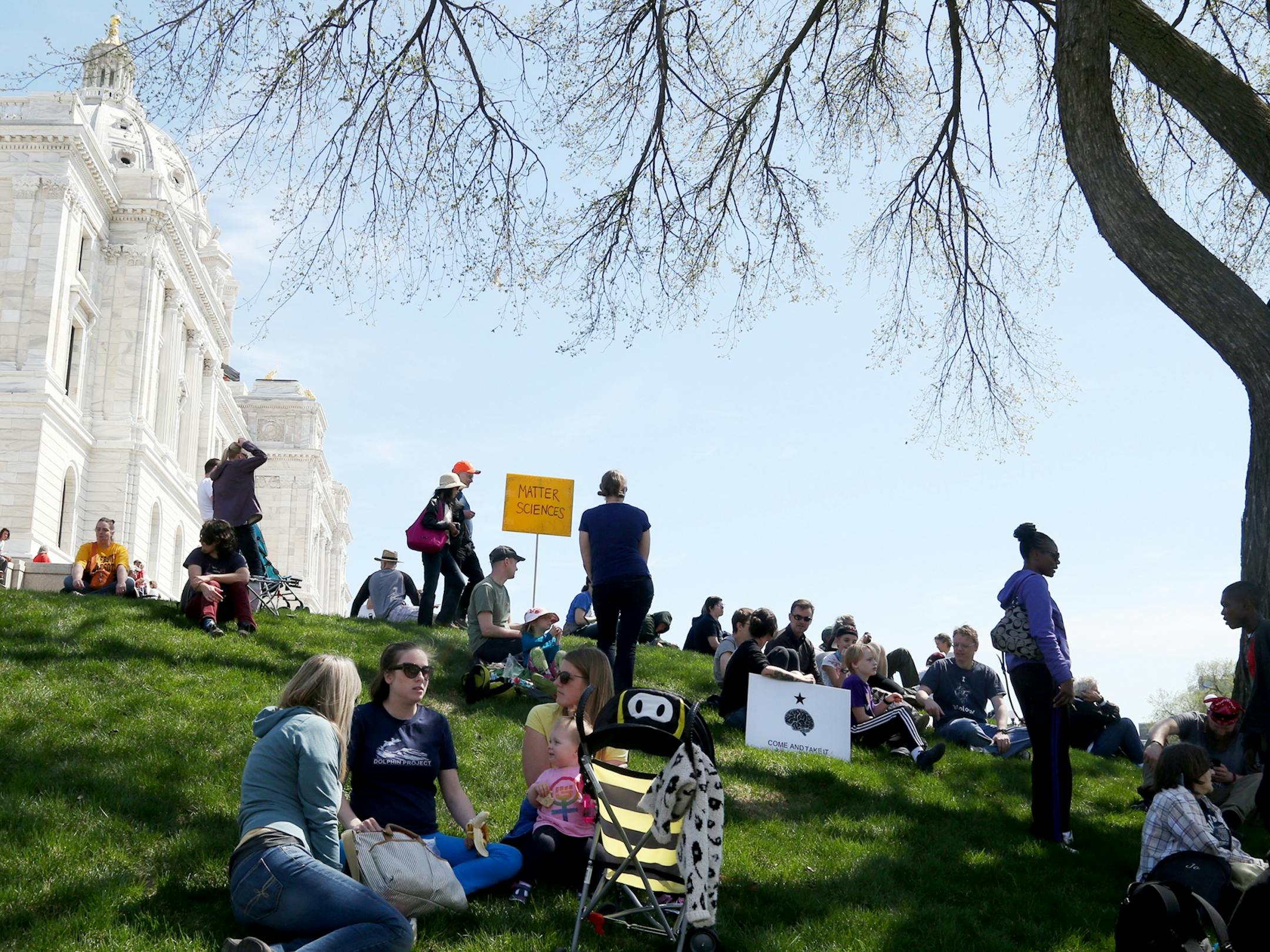 March for Science moved from the start at Cathedral Hill Park to State Capitol, with an estimated 10,000 or more joining to champion the role of science in American life. Here, some of the thousands of science supporters that came for the march rested on the lawn outside the State Capitol Saturday, April 22, 2017, in St. Paul, MN.