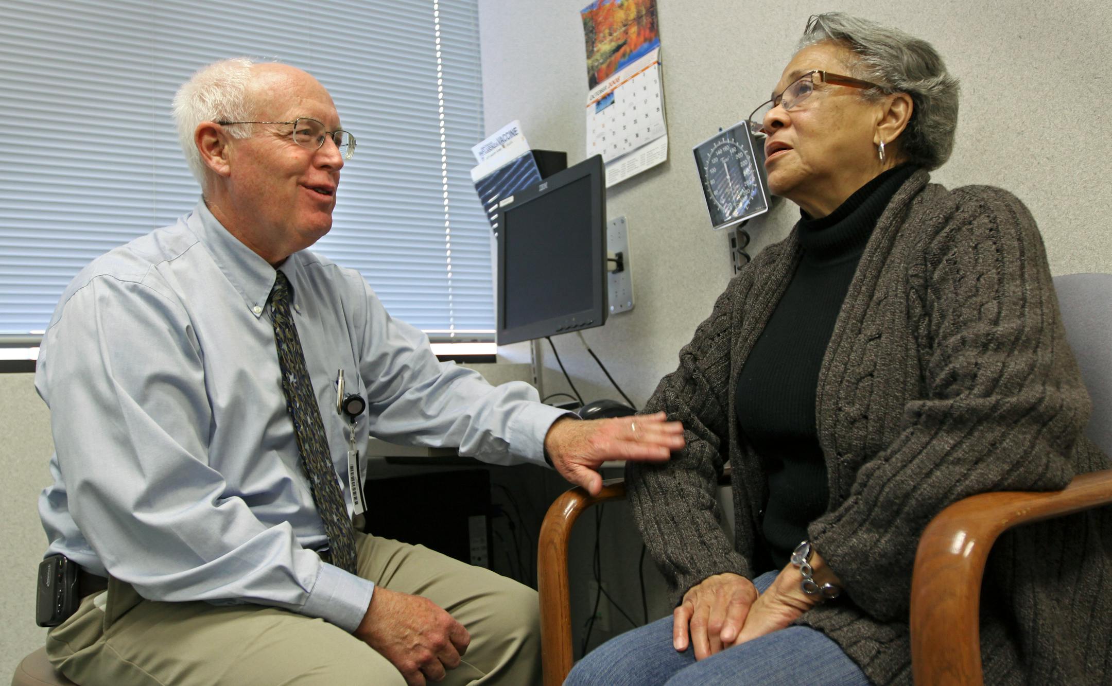 (left to right) Dr. Dick Adair talked with patient Letitia McLaughlin of Minneapolis, during a visit at the ANGMA Medical clinic in Minneapolis.