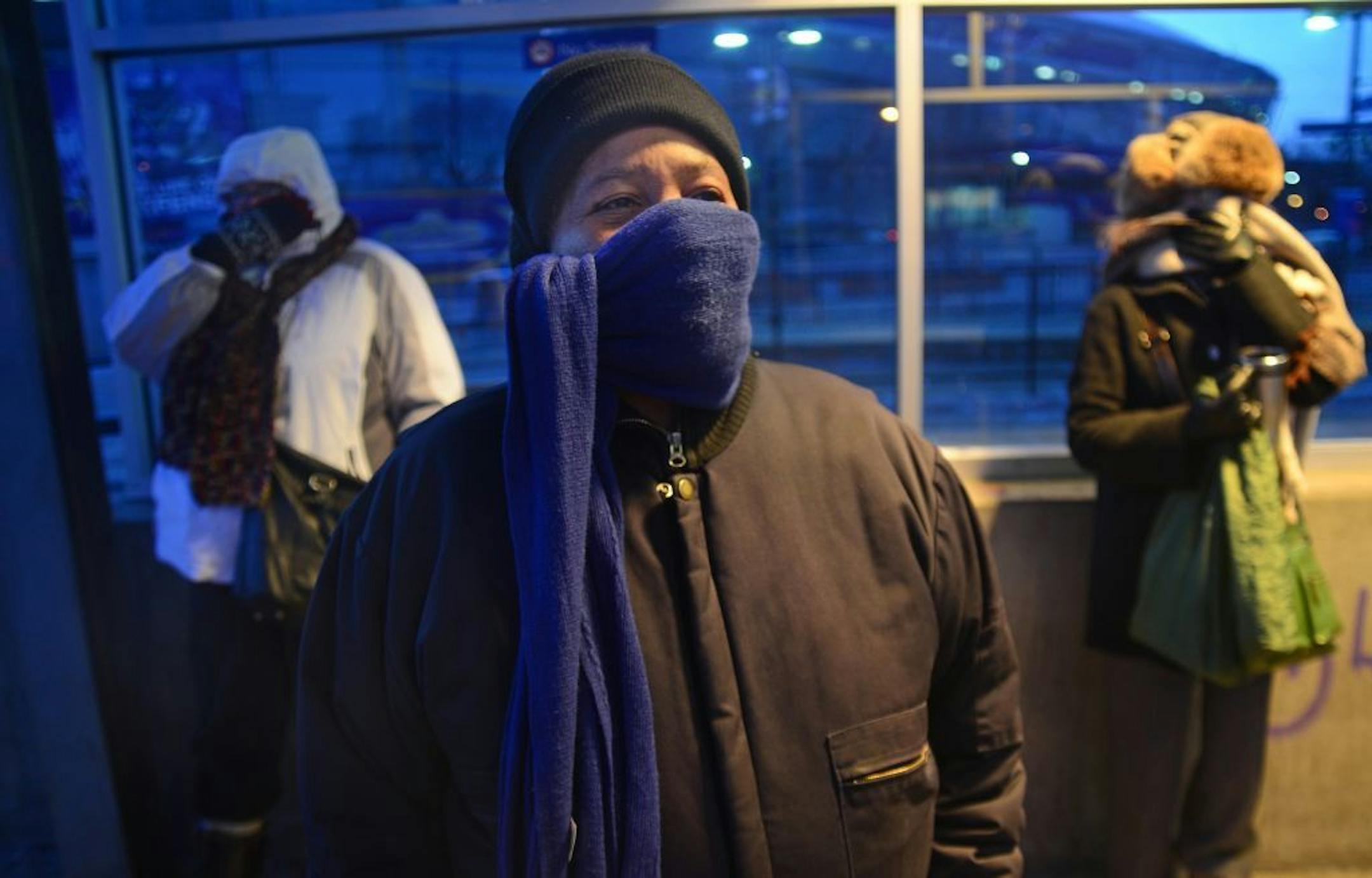 Ann Pointer of Minneapolis stood in the cold blue light of dawn at a bus stop near the Metrodome, waiting for a bus, with the temperature around 10 below zero.