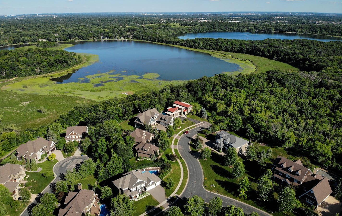 The Lennar Corp. has entered an option agreement to purchase 188 acres of land owned by Prince's estate, as seen from beyond the Lake Lucy Ridge housing community Tuesday afternoon in Chanhassen. Lennar Corp. purchased the vacant land near Lake Ann, top right, and plans to build on the site where the late musician once lived in a yellow three-story mansion. ] AARON LAVINSKY &#x2022; aaron.lavinsky@startribune.com One of Prince's most valuable real estate properties -- a 188-acre parcel in Chanha